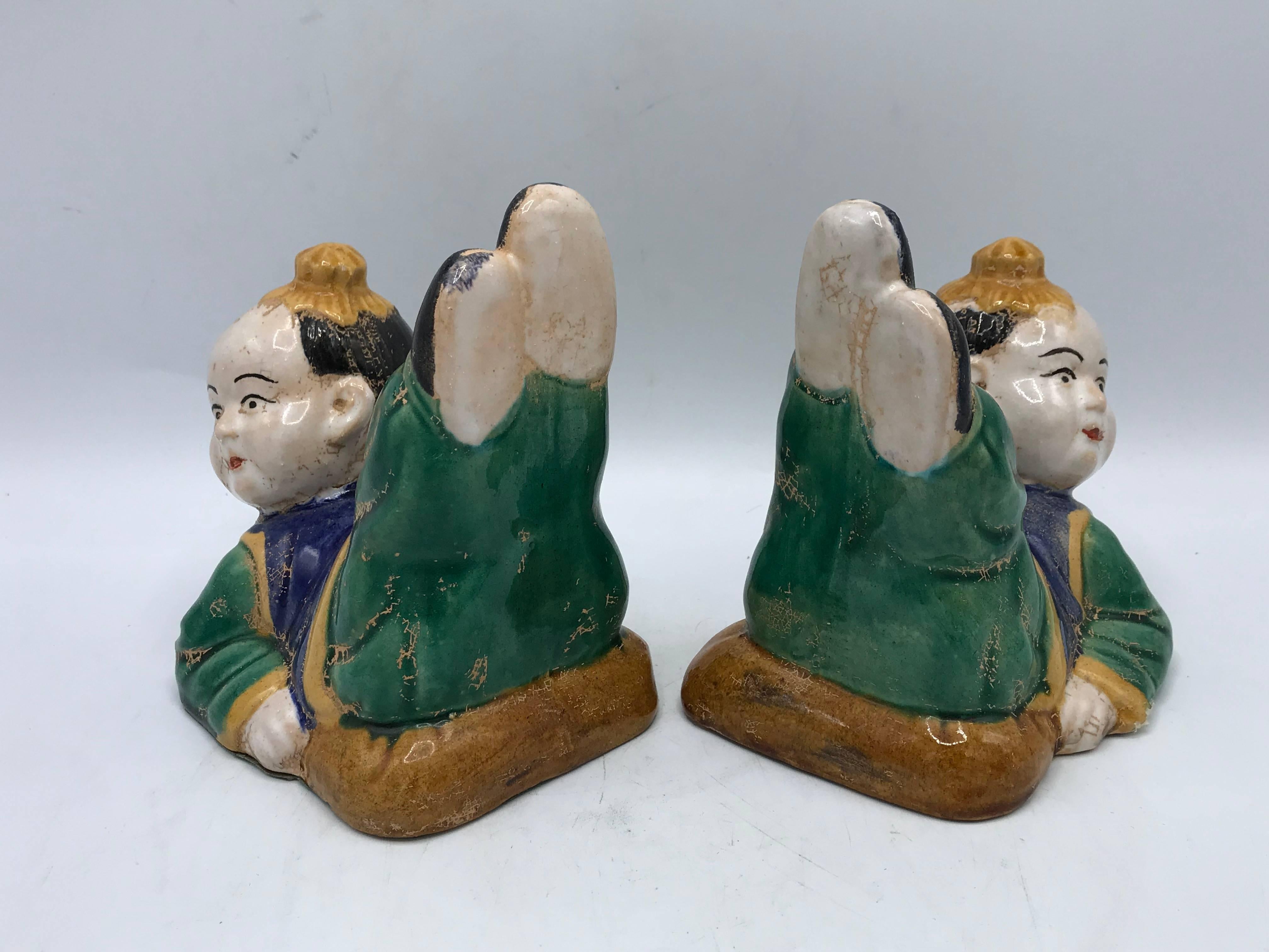 Offered is a fabulous, pair of 1960s Chinoiserie chic, sculptural Asian children bookends. These pieces would look beautiful as freestanding statues as well.