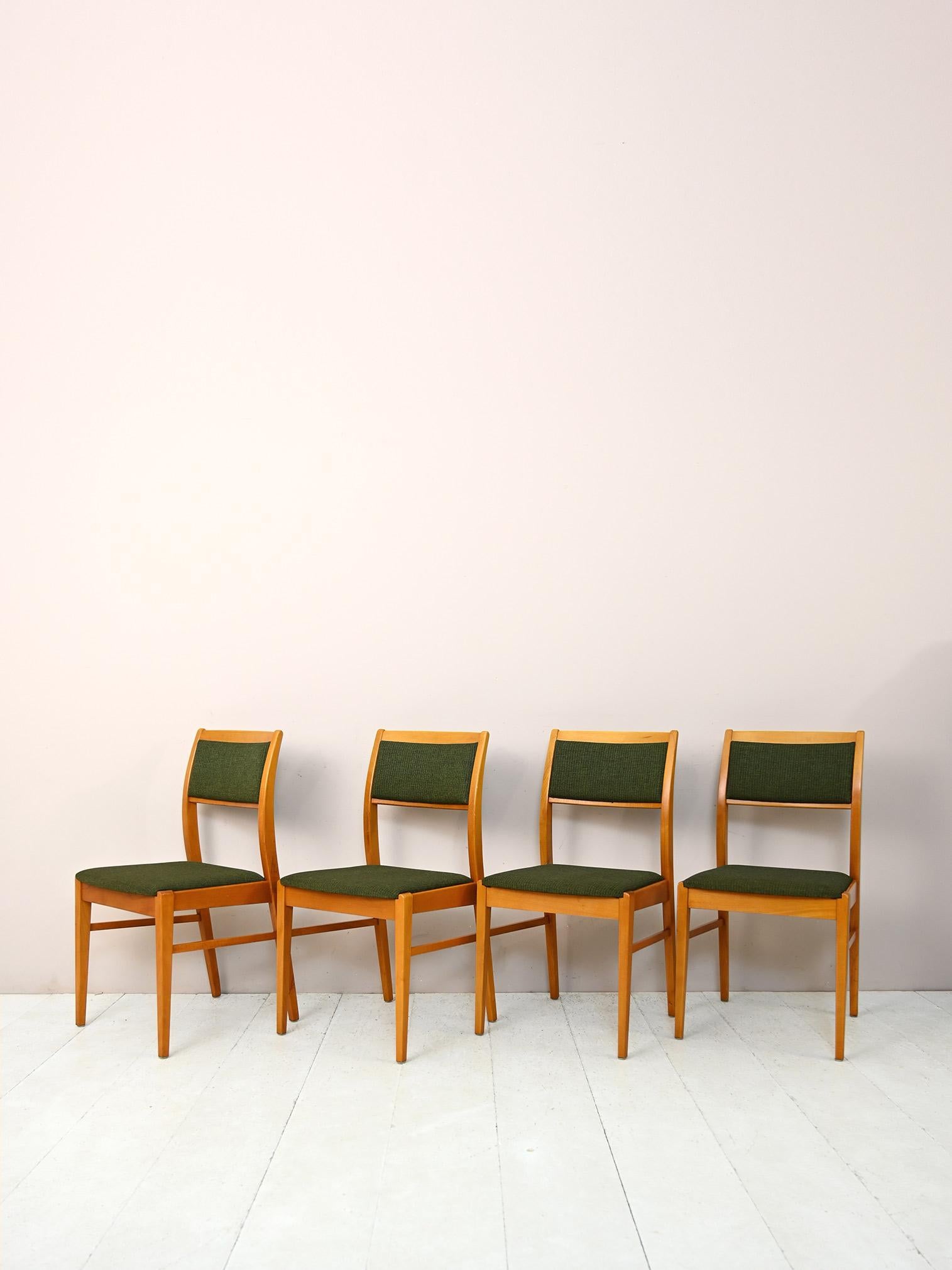 Set of 4 original vintage Scandinavian chairs.

This chair model harks back to the typical mid-century style. The lightweight frame is made of birch wood while the back and seat are upholstered and lined with original vintage green