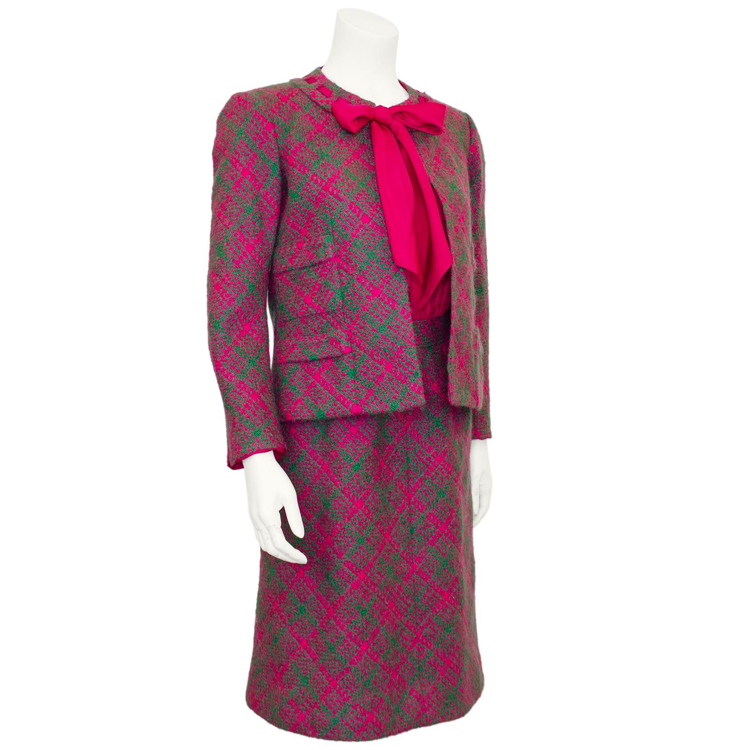 Absolutely stunning and vibrant magenta and green tweed Chanel Haute Couture dress and jacket ensemble from the 1960s. The collarless open jacket has a magenta silk scarf detail woven through and around the collar and can be tied in a bow or knot to