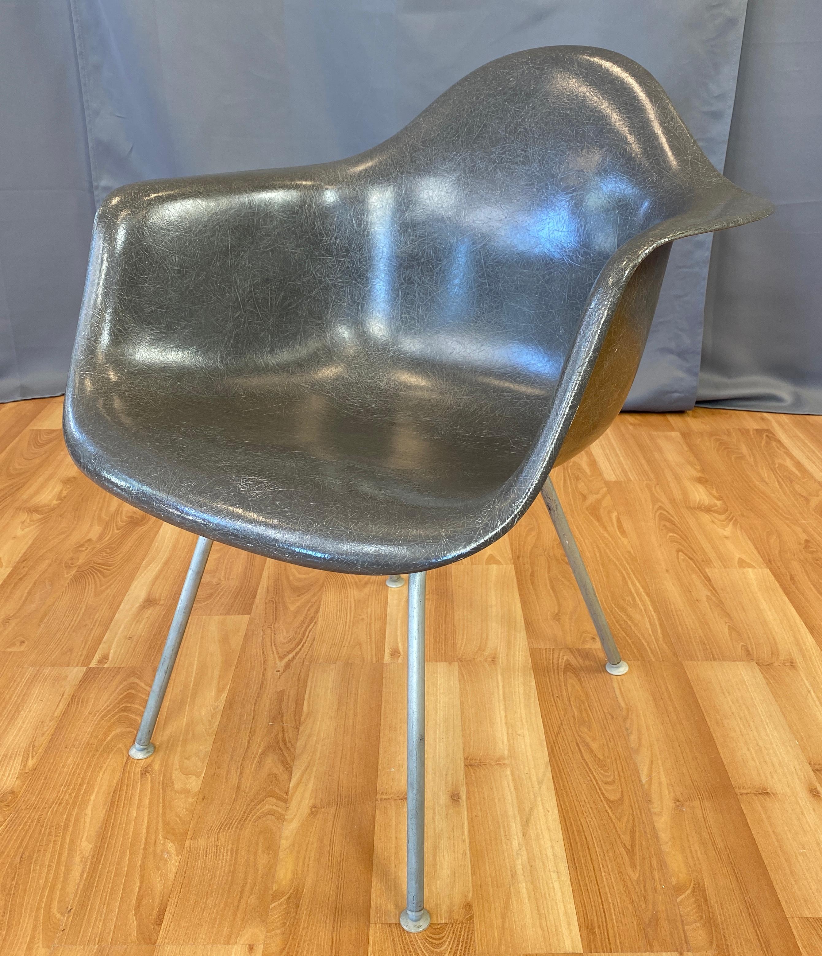A circa 1960s Charles Eames fiberglass shell armchair for Herman Miller, in a elephant hide gray color.
