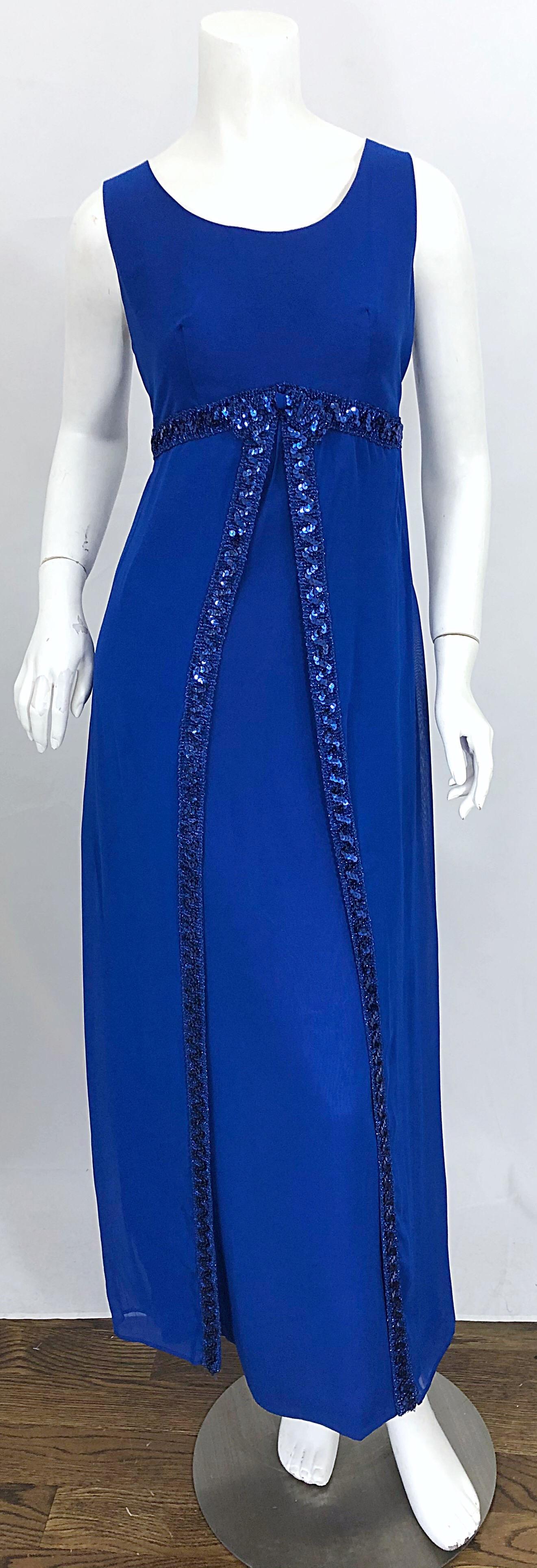Beautiful 1960s CHARMONT MODEL by BURKEMAN & PASSES royal blue silk chiffon sequined gown! Features a tailored bodice, with a straight skirt and overlay. Hundreds of hand-sewn sequins under the bust and down the front center overlay. Full metal