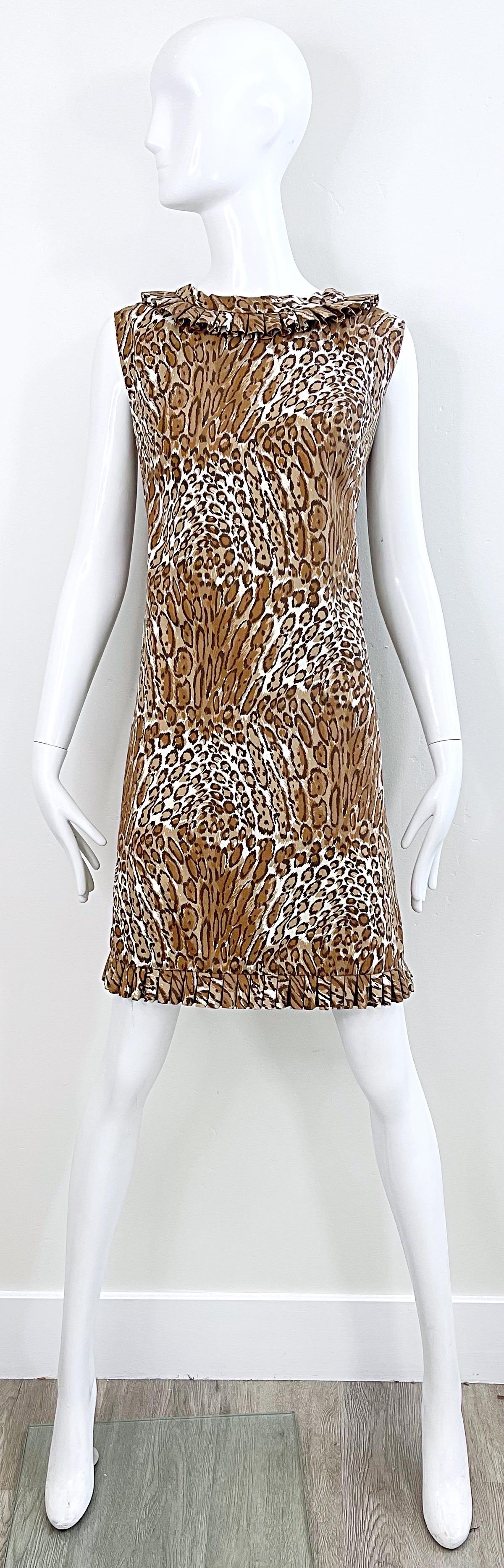 Chic 1960s leopard / cheetah abstract animal print cotton shirt dress ! Features ruffle details at collar and at hem. Full metal zipper up the back with hook-and-eye closure. Single pocket at left side of waist. Very well made. Perfect to go from