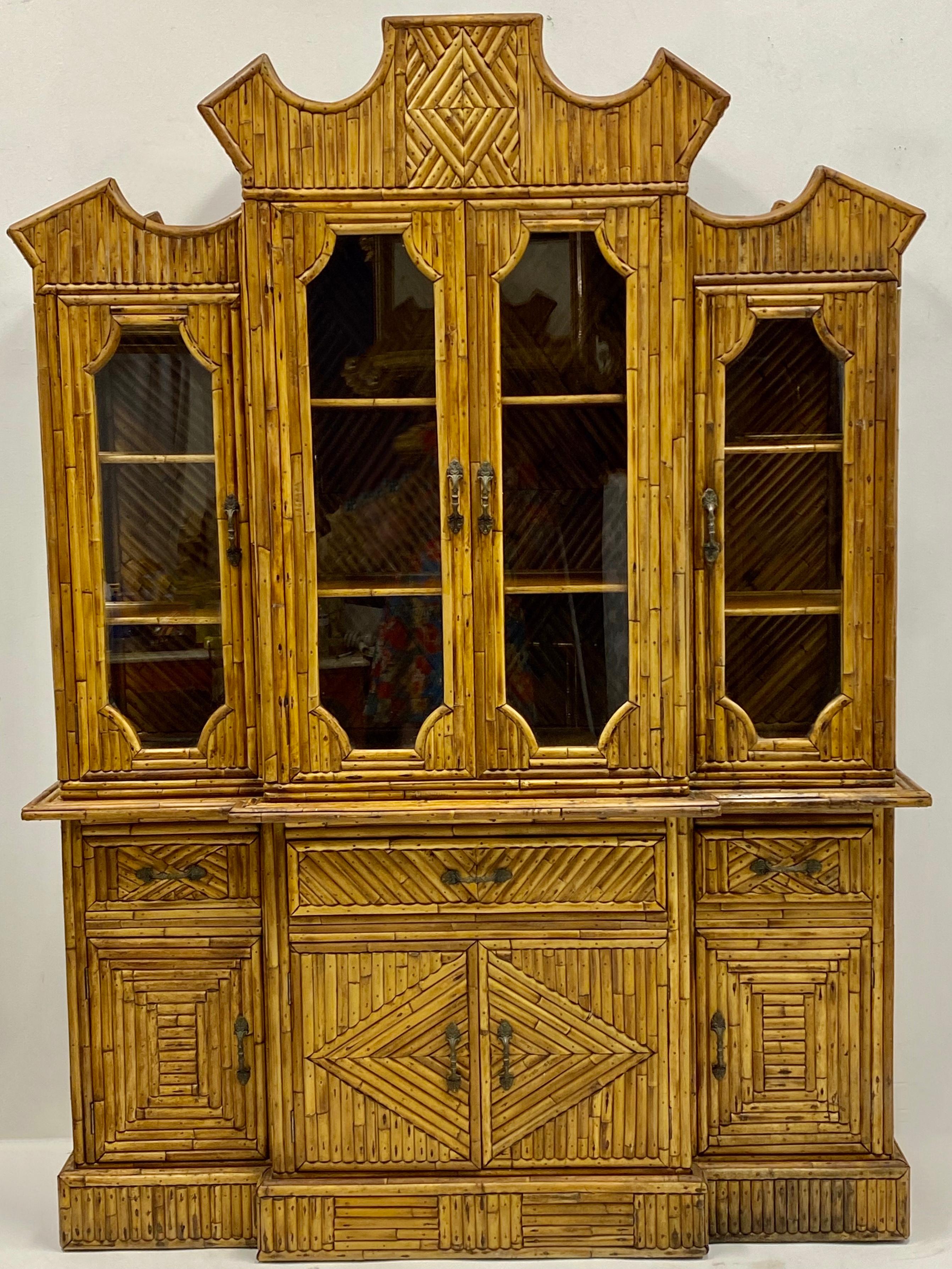 This is a 1960s pencil bamboo cabinet with Chinese Chippendale styling. It is in two pieces for easy shipping, and it is unmarked. I have acquired 4 bun feet for this cabinet and can include if so desired. A great piece!