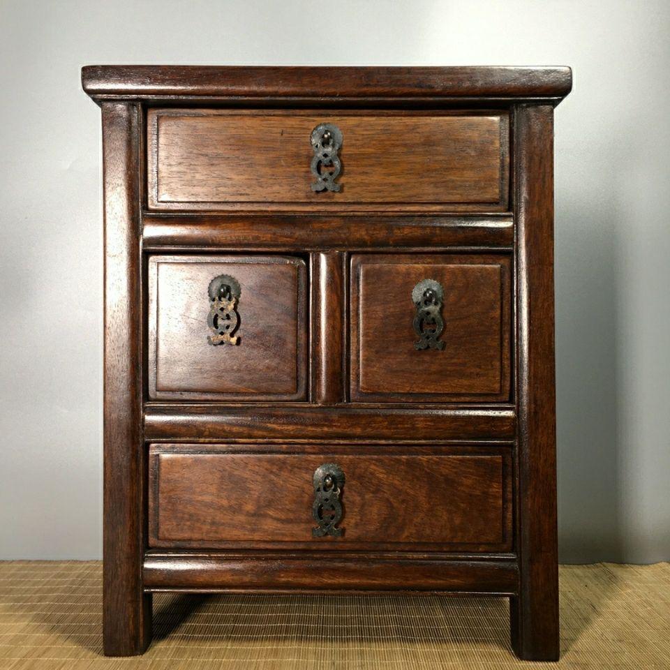 Bring timeless elegance into your home with this 1960s Chinese Classic Wood Four Drawers Cabinet, a vintage masterpiece reflecting the rich heritage of traditional Chinese craftsmanship. Handcrafted from premium solid wood, this cabinet boasts a