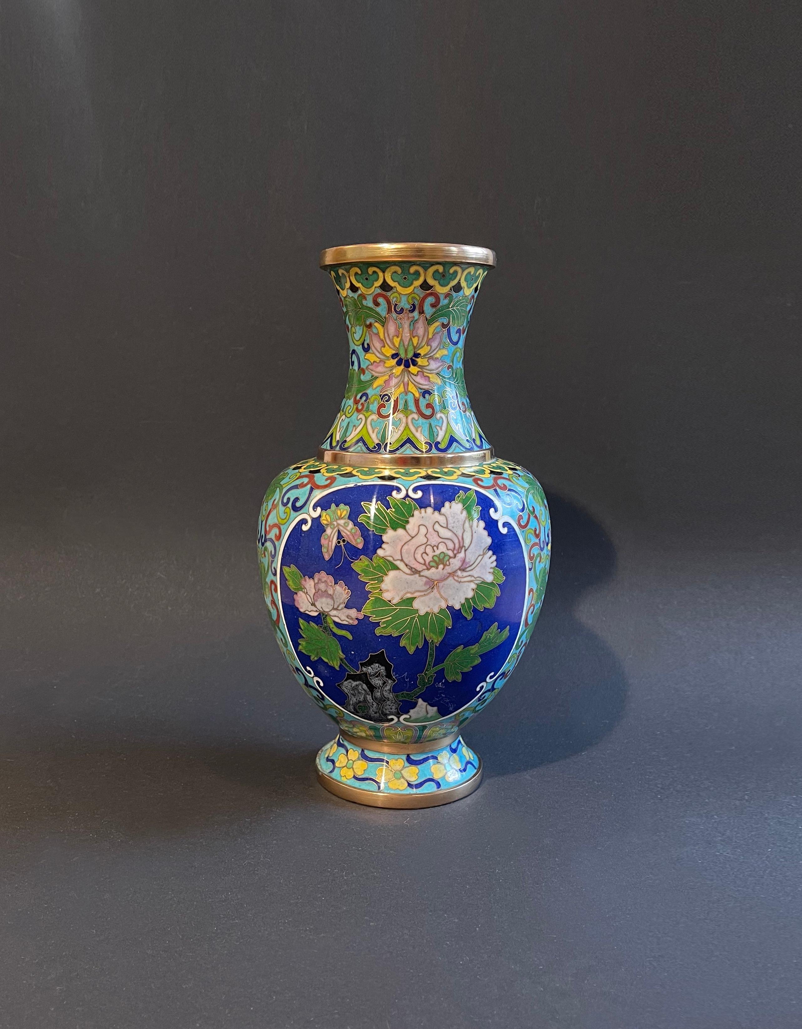 Expressive and intricately detailed Cloisonné bowl of medium size in turquoise, lapis blue, yellow & green.
The metal filigree in brass beautifully detailed with butterflies, chrysanthemum in a mild pink and other flowers with leaves and some purple