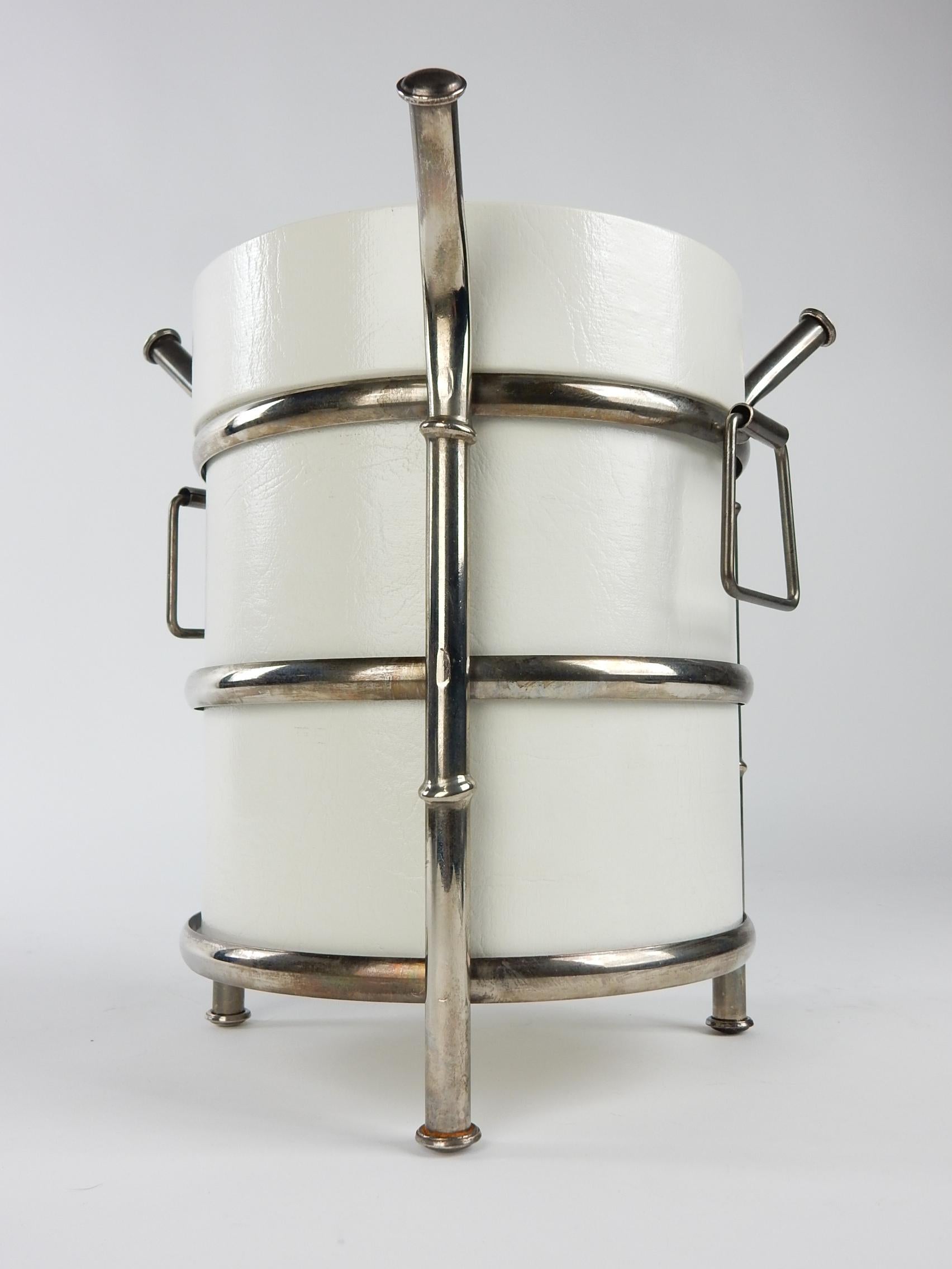 1960's silver plate metal faux bamboo and white vinyl ice bucket.
Exceptional quality piece with aged patina on silver. 
Shows little to no wear at all.
  