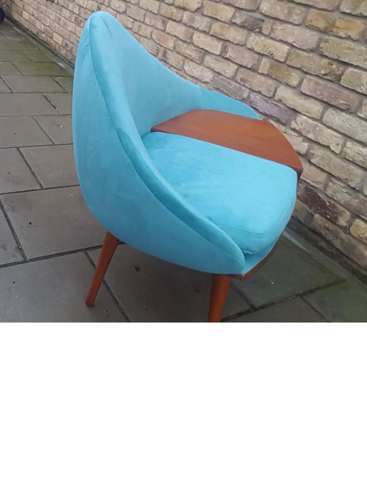 Well-shaped sofa telephone table upholstered in lovely blue fabric
with front storage draw and wonderful tapered lags.
by Chippy Heath uk.