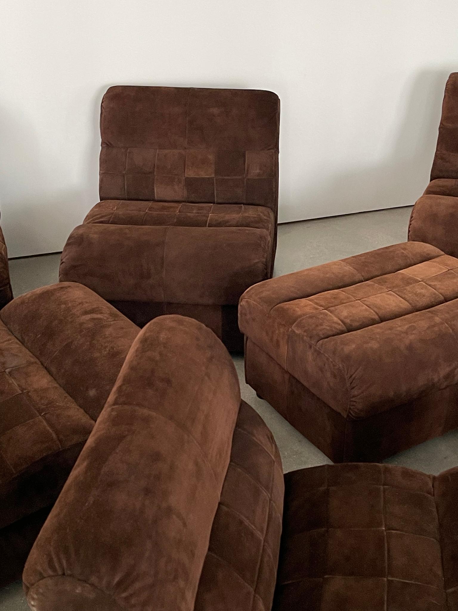 This 1960's Chocolate Suede Patchwork Percival Lafer Sectional Sofa come with 7 pieces including an ottoman and a corner piece. Modern Brazilian sofa is very versatile with strong suede patchwork. Customize it and break it up within your living room