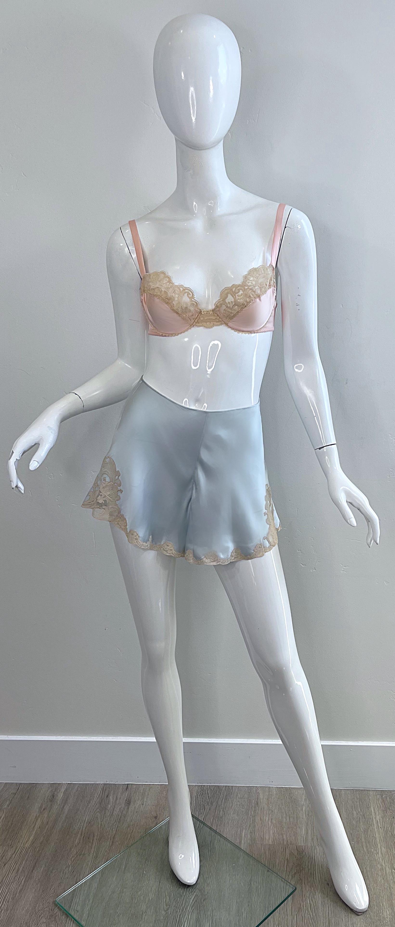 Rare 1960s Christian Dior silk lingerie set ! Features baby blue silk bloomer shorts that have a button closure on the back. Two different bras—one in pink, and one in ivory. Dior logo etched at center bust. Adjustable straps and backing.
Comes from