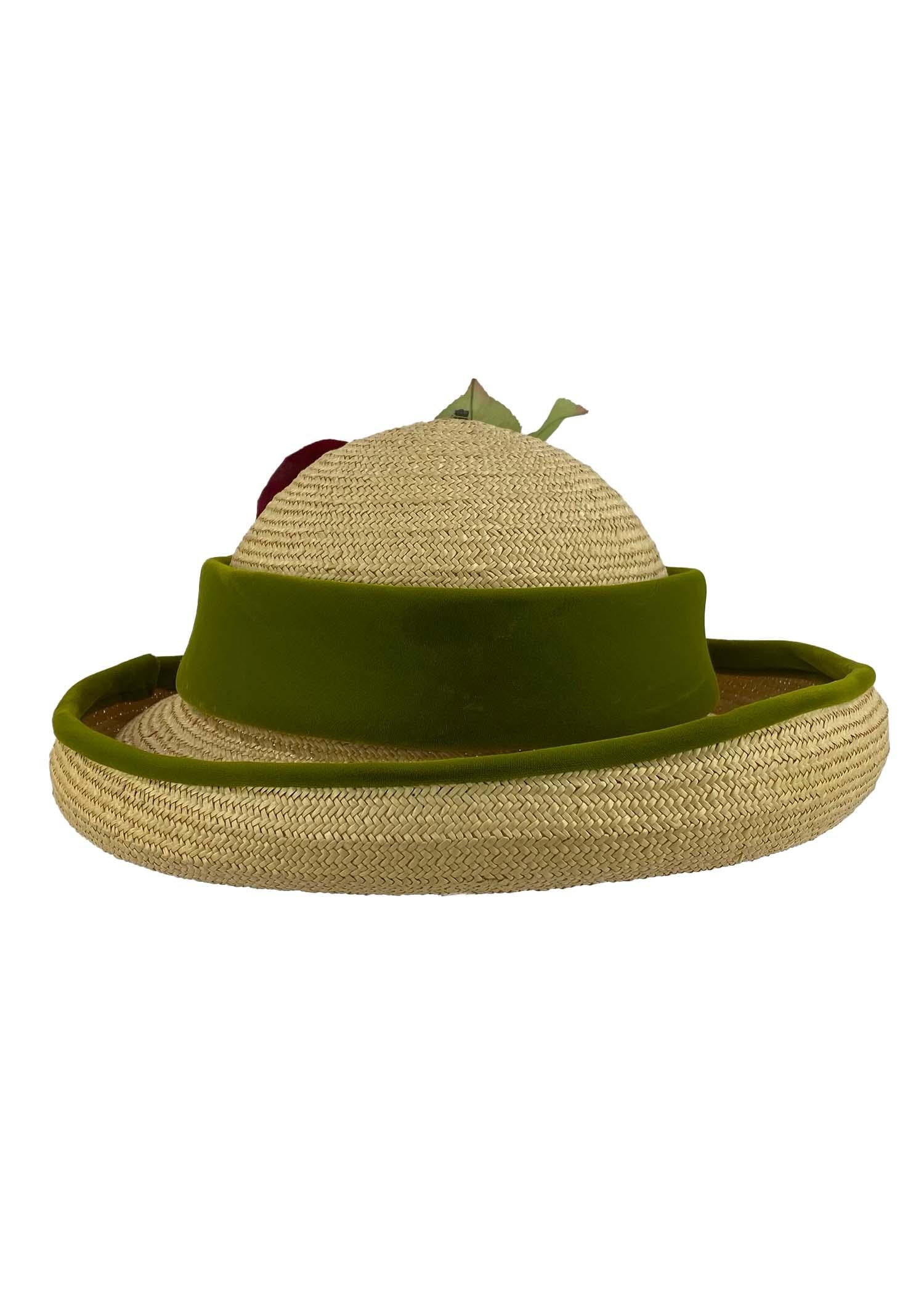 Presenting a playful velvet-trimmed wicker hat with a faux rose blossom. This piece was designed in the 1960s while the house was under the creative direction of Marc Bohan. 

Approximate measurements: 
Height: 4.75