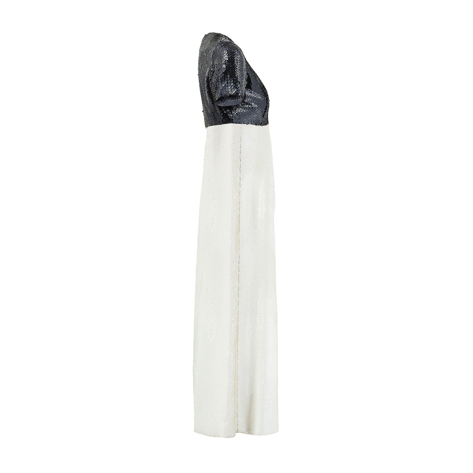 This elegant Christian Dior evening dress was retailed in their London branch during the late 1960s and may have been a special order from Paris.  Designed when Marc Bohan was creative director, he is remembered for his clean, A-line silhouettes and