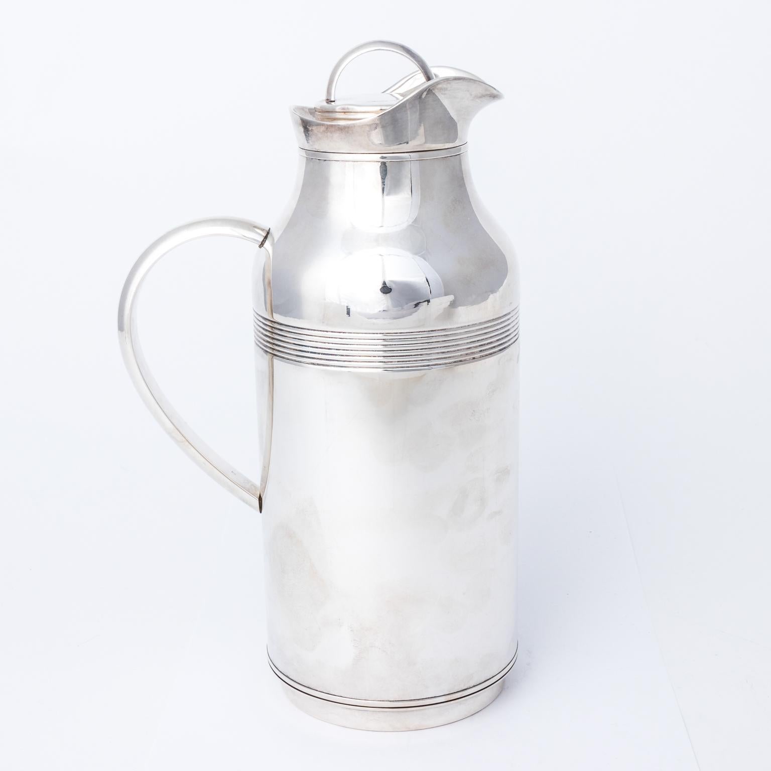 1960s Christofle vintage silver plate thermos with decorative ridge banding and curved handle.
 
