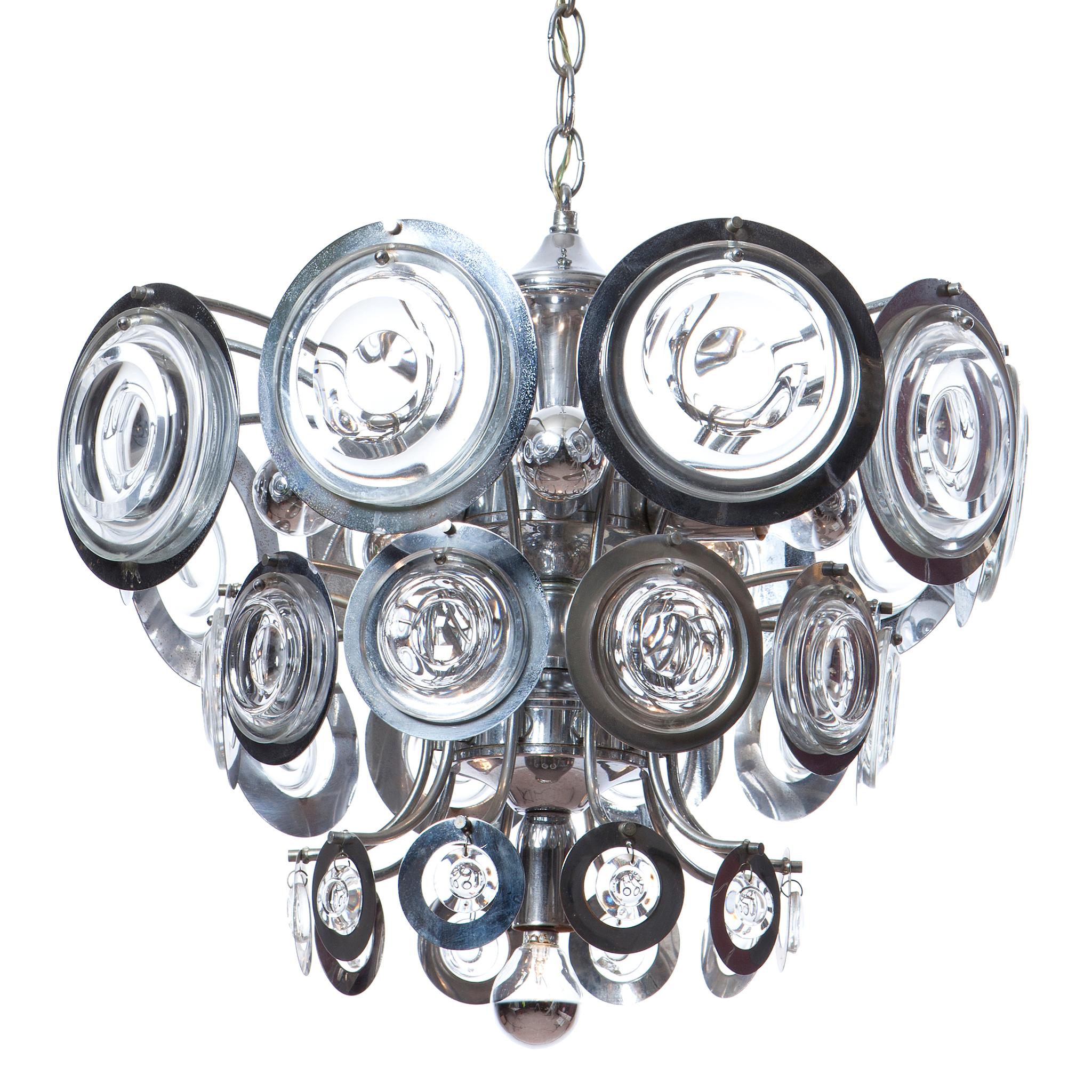 This striking chandelier has 3 levels of chrome rings and fitted glass, the reflection makes the light twinkle from every spot in the room. 6 lightbulb fitting.
