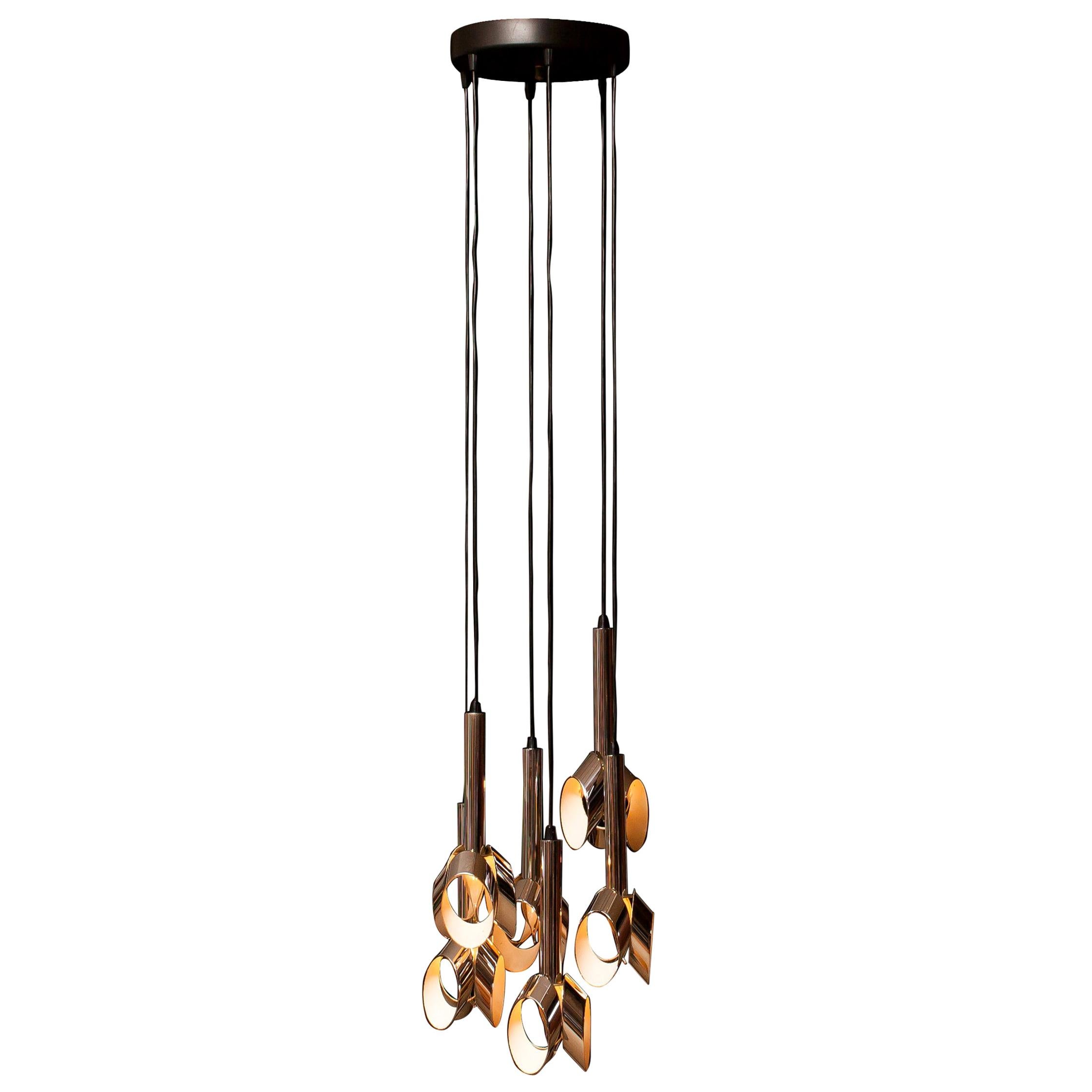 Beautiful ceiling lamp or chandelier by RAAK, Amsterdam.
This lamp consists of six chromed, with white lacquered details, pendants who are adjustable in height.
Period: 1960s.
Dimensions: H 135 cm, Ø 35 cm.

 