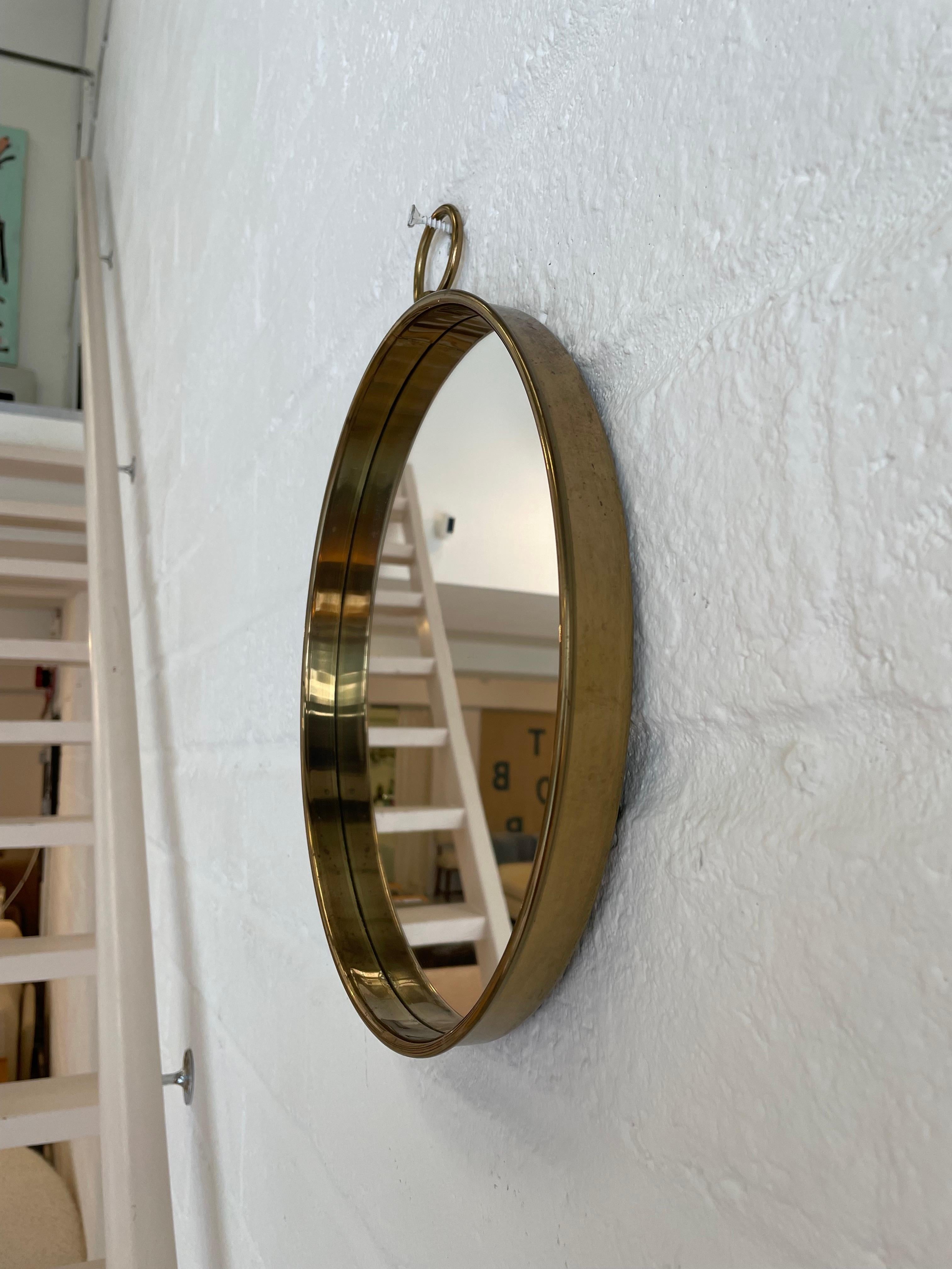 Mid-Century Modern 1960s Circular Brass Wall Mirror For Sale