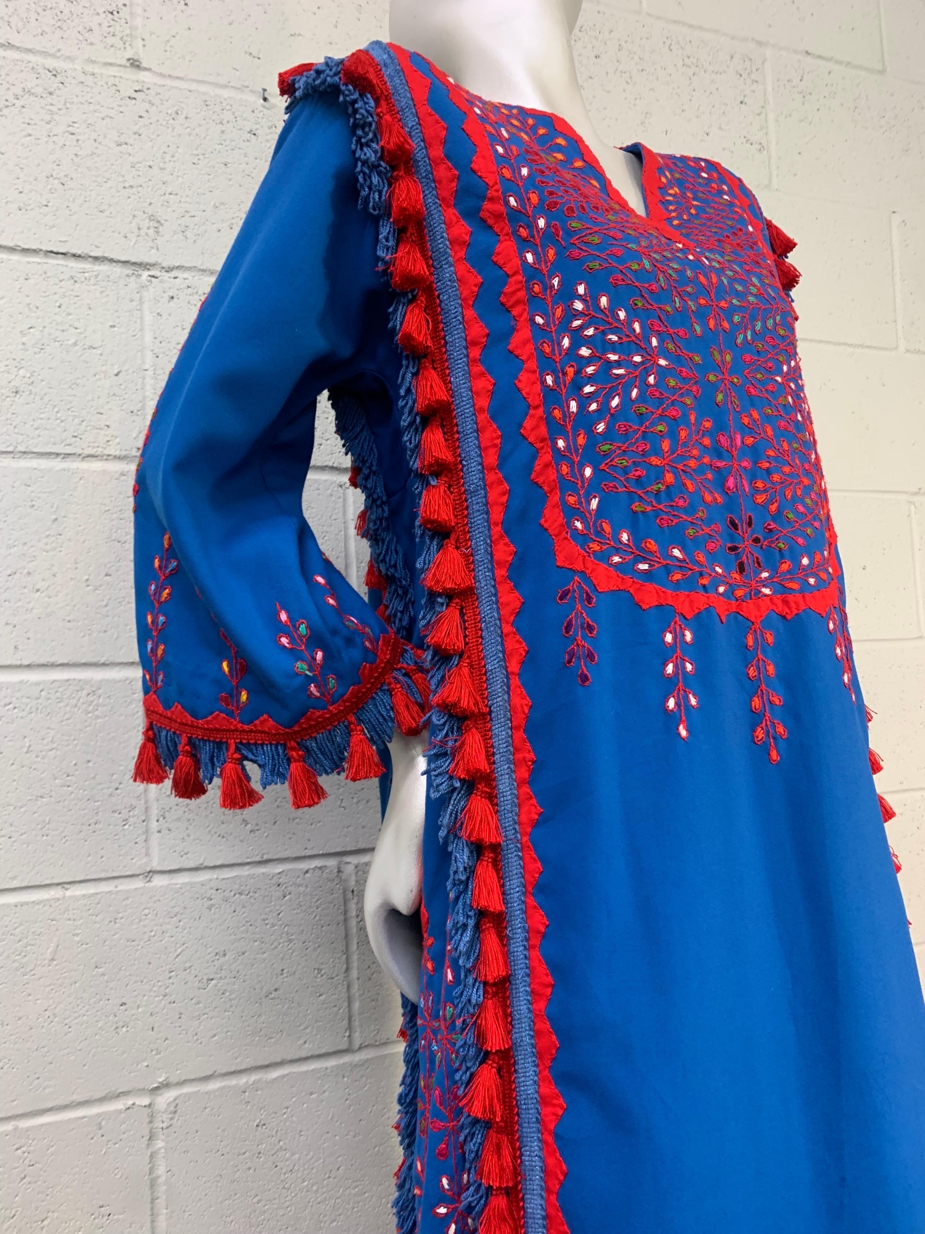 1960s Torso Creations Cobalt Blue and Red Cotton Caftan with Traditional Embroidery and Tassels: 1960s classic caftan remastered for today. Side slit pockets, Lots of tassel fringe in coordinating colors adds life, movement and interest to this Boho