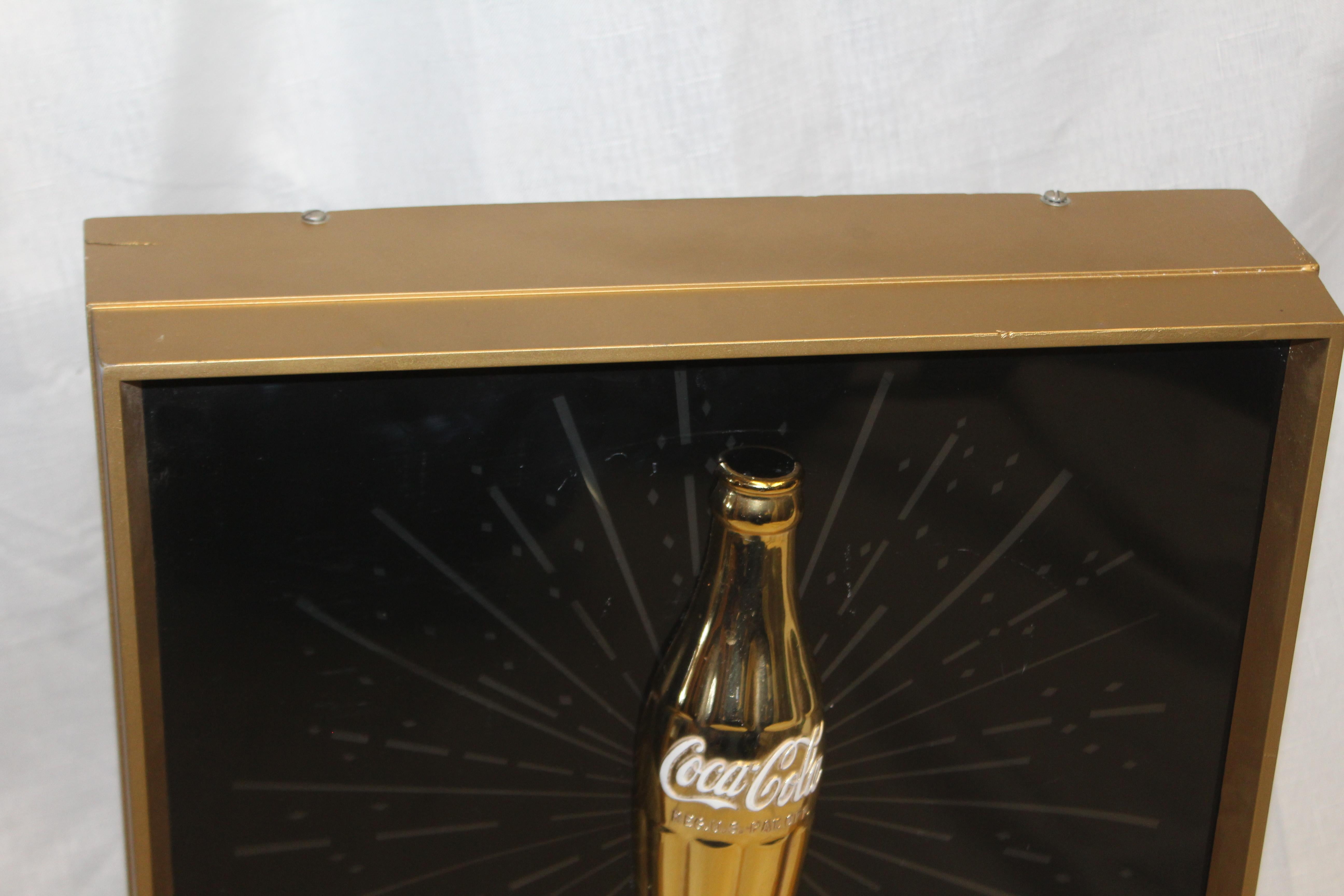This 1960s light up advertising sign s 1 of 3 versions. This one has the gold bottle vs the glass or paper cup. This sign also has the great fishtail logo that also lights up.