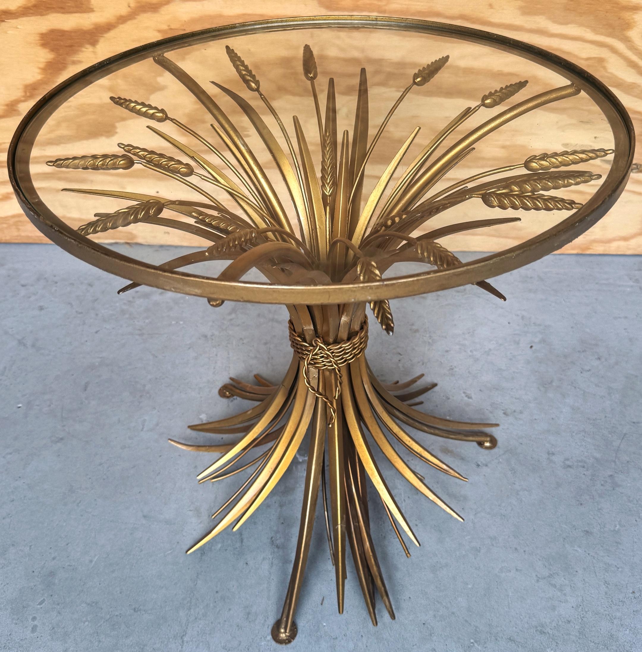 1960's Coco Chanel Style Sheaf Of Wheat Gilt Side Table
Italy, circa 1960s 

A stunning piece of mid-century design: a 1960s Coco Chanel Style Sheaf of Wheat Gilt Side Table, made in Italy. This exquisite table embodies the elegance and