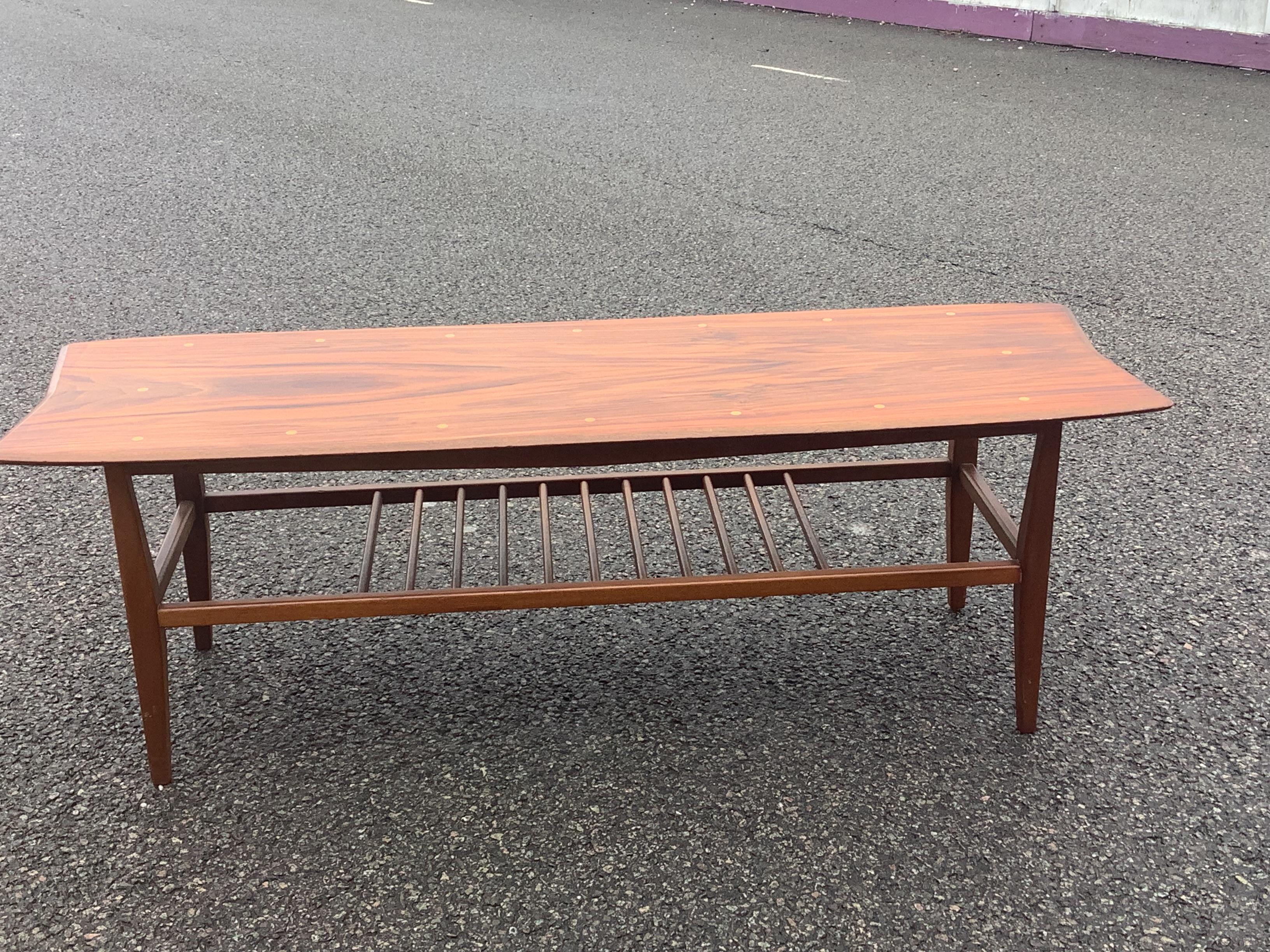 This is a charming original rare coffee table is made by the UK brand Everest. It was normally retailed through Heals. 


walnut coffee table with sycamore detailing Featuring an organic shaped top with a chamfered edge in a richly figured and