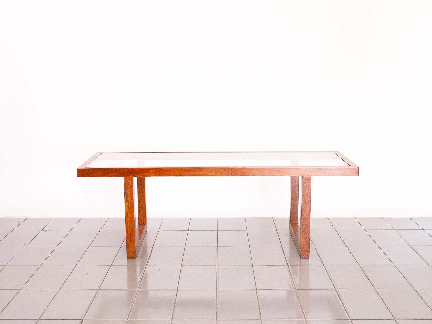 This beautiful 1960's coffee table has all the characteristics of Tenreiro's work: perfect mitter joints, flush glass alignment, elegance. This coffee table is very similar to several of his rectangular coffee tables. Great for small lounges or for