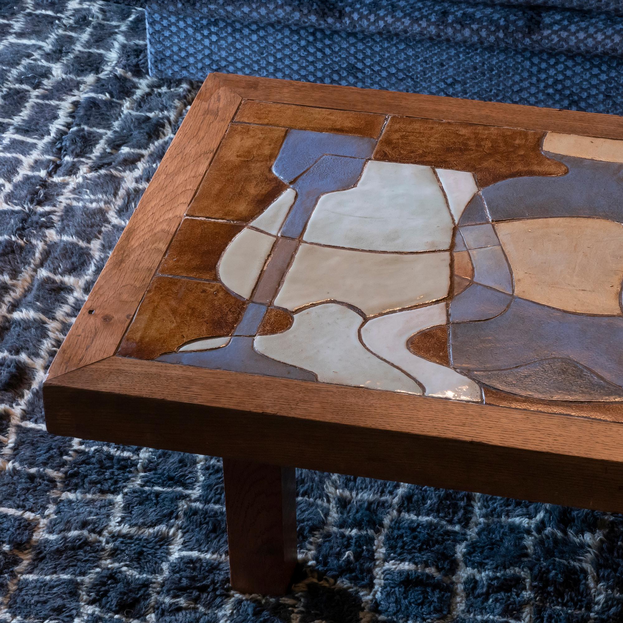 Oak base coffee table with decorative multicolored ceramic tiles top cubist style, signed Le Trident Vallarius, France, 1960s.