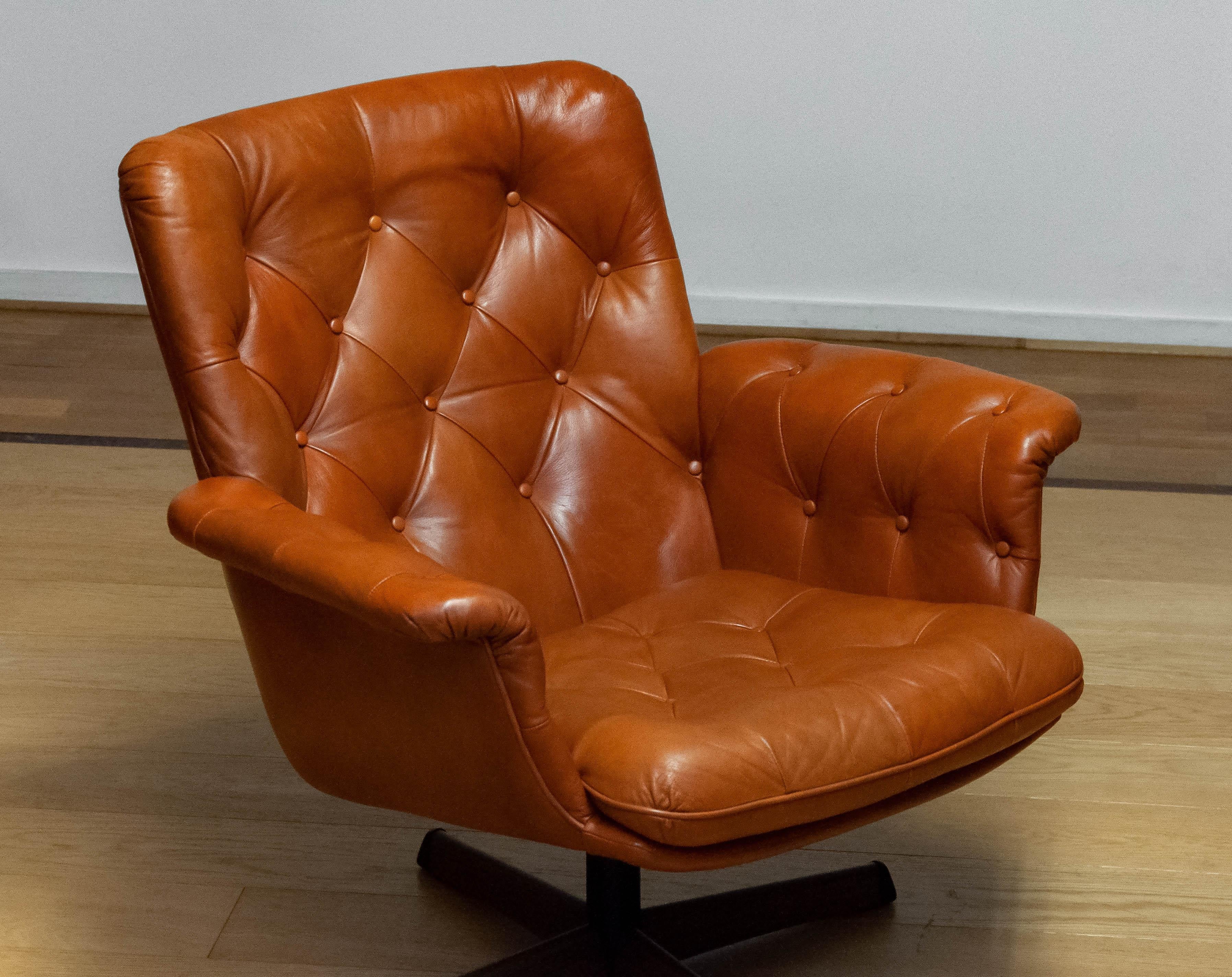 Scandinavian Modern 1960s Cognac Leather EVA Swivel Chair Göte Nassjö Sweden. B For Sale