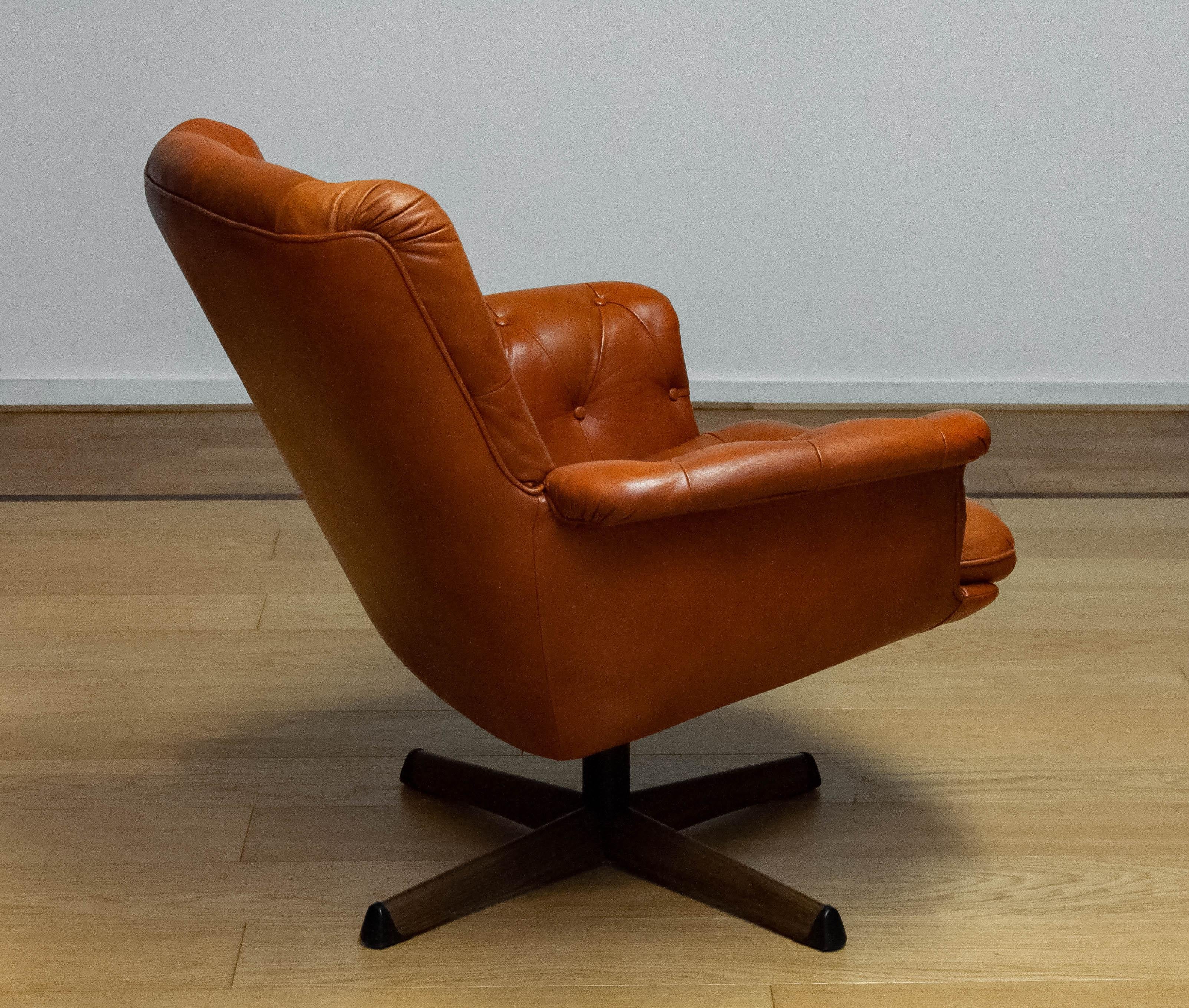 Swedish 1960s Cognac Leather EVA Swivel Chair Göte Nassjö Sweden. B For Sale