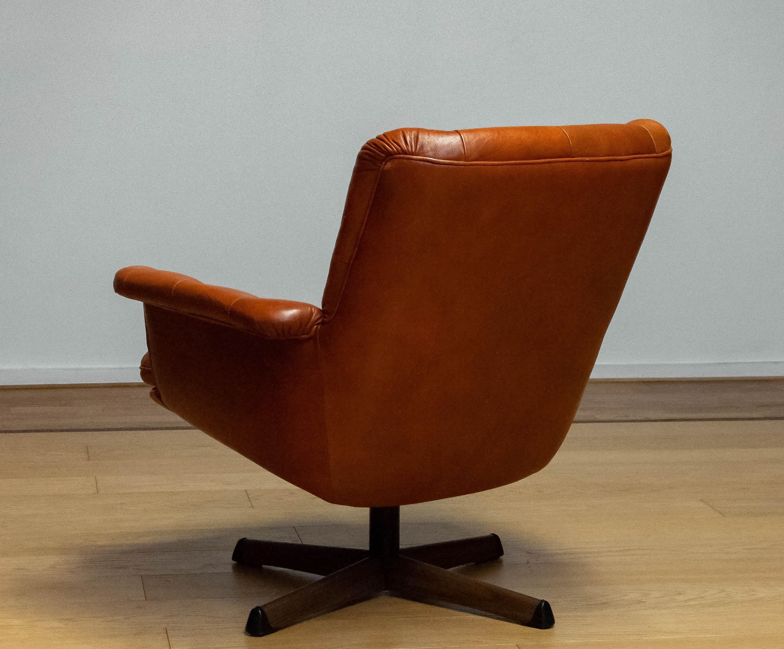 Metal 1960s Cognac Leather EVA Swivel Chair Göte Nassjö Sweden. B For Sale