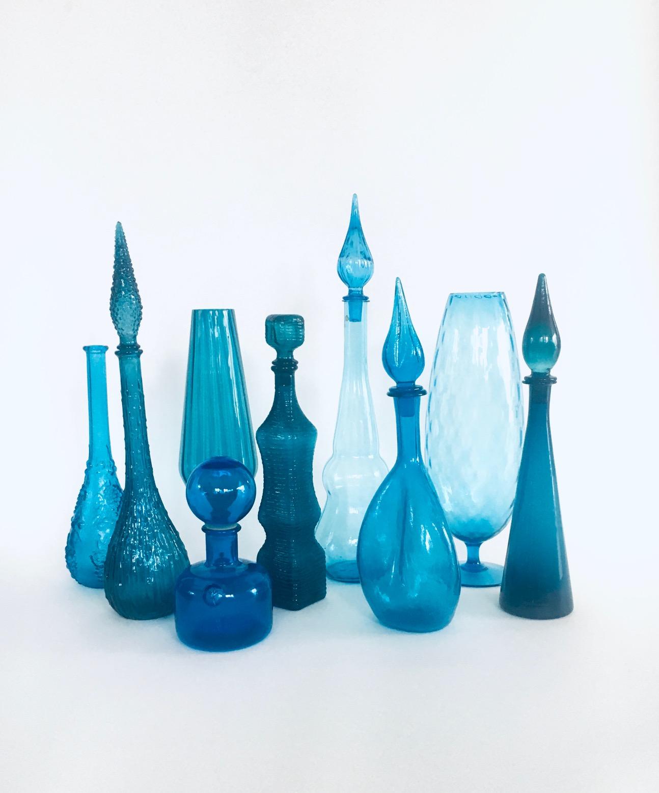 Collection of vintage Blue Glass Vases & Decanters. All are made in the 1960's era. Italy, France, Scandinavia made. Empoli and other design glass. Set of 9 different pieces. All are in blue glass different tones, shapes and models. from 23cm to
