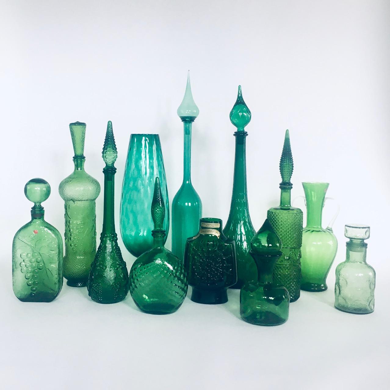 Collection of vintage Green Glass Vases & Decanters. All are made in the 1960's era. Italy and France made. Empoli and other design glass. Set of 12 different pieces. All are in green glass different tones, shapes and models. From 25cm to 71cm tall.