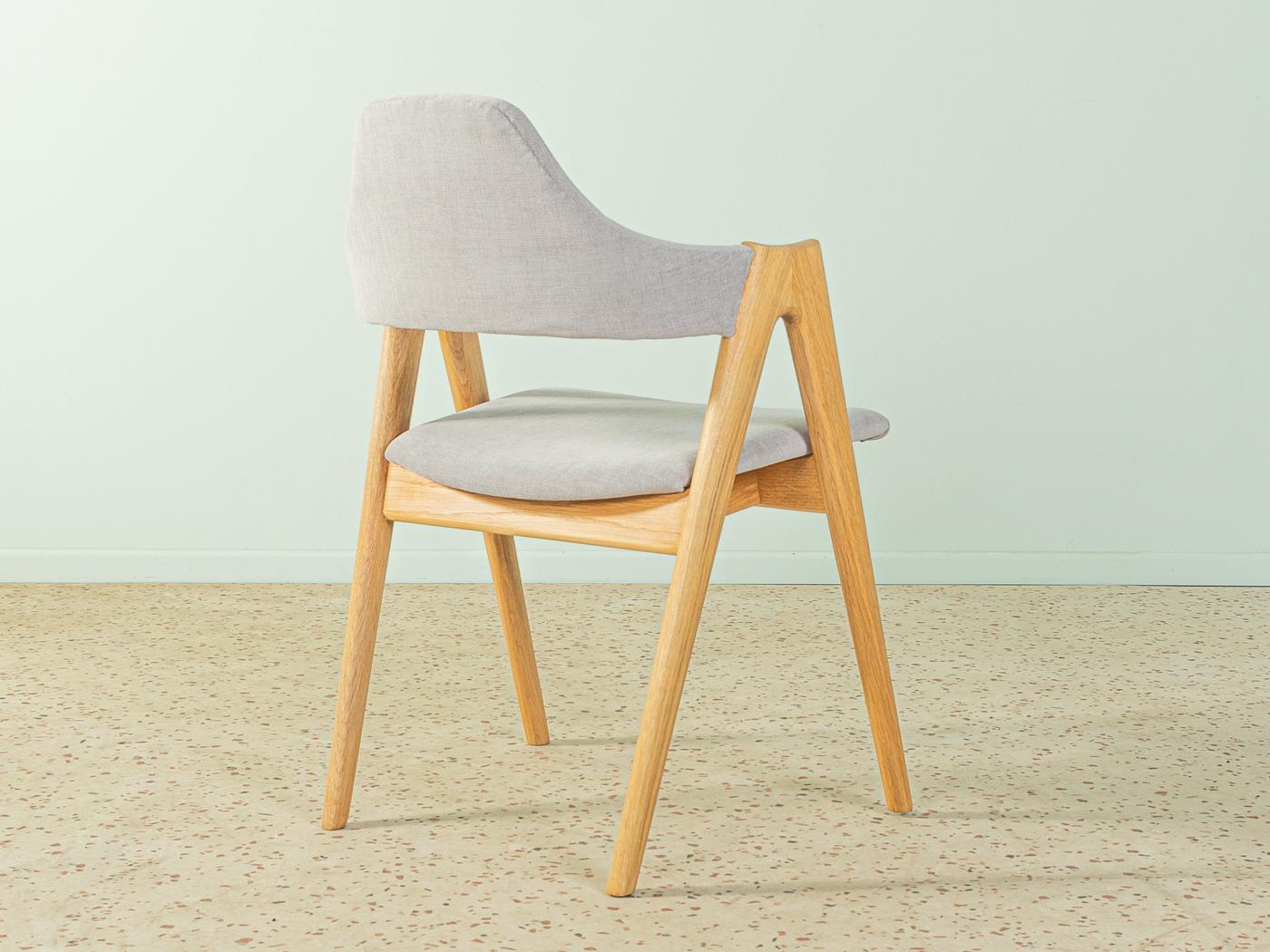 Elegant chair designed by Kai Kristiansen for SVA Møbler in the 1960s. Solid oak frame. The chair has been reupholstered and covered with a high-quality bright greyupholstery fabric.

Quality Features:
    very good workmanship
    high-quality
