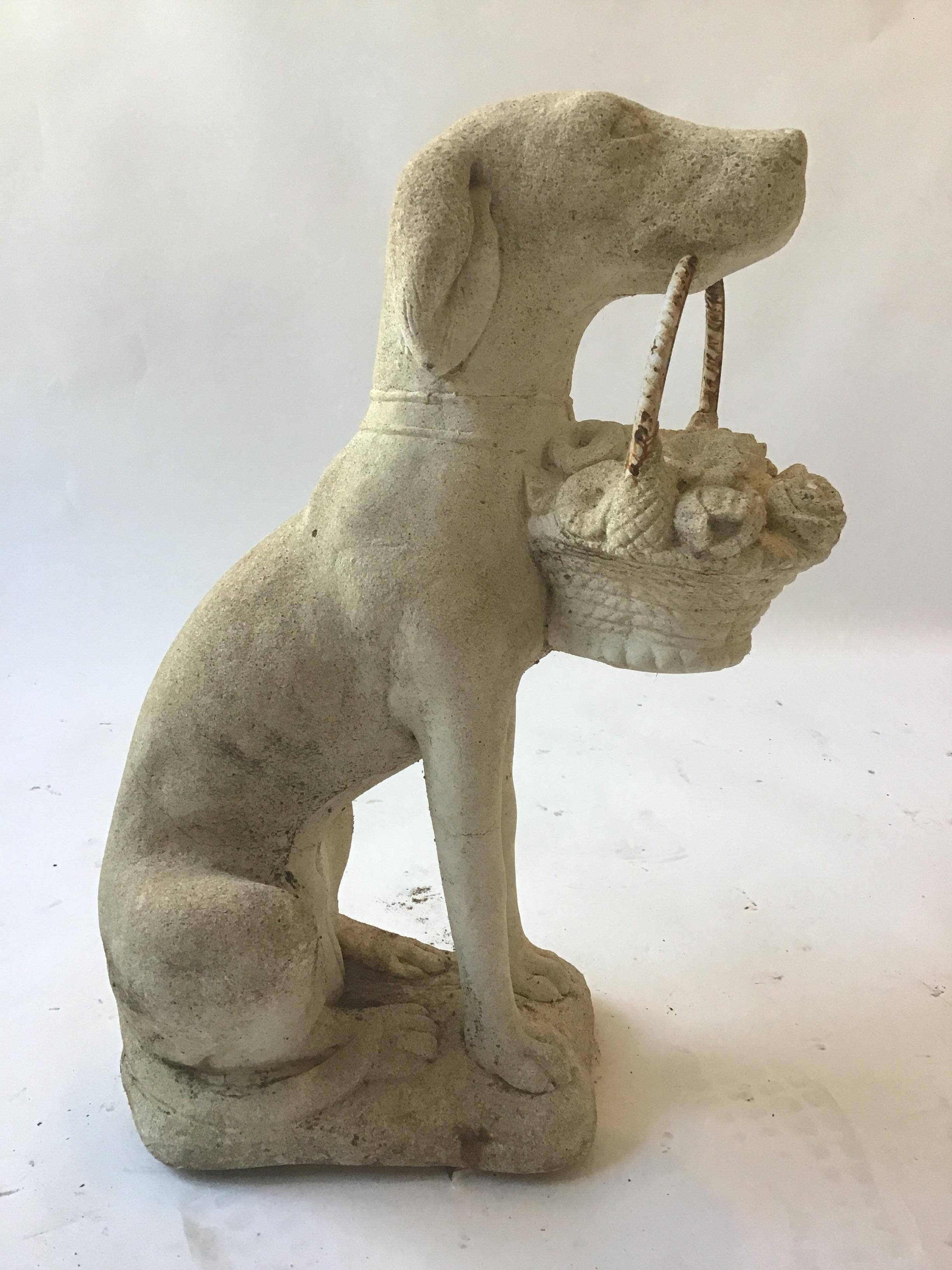 concrete dog with basket in mouth