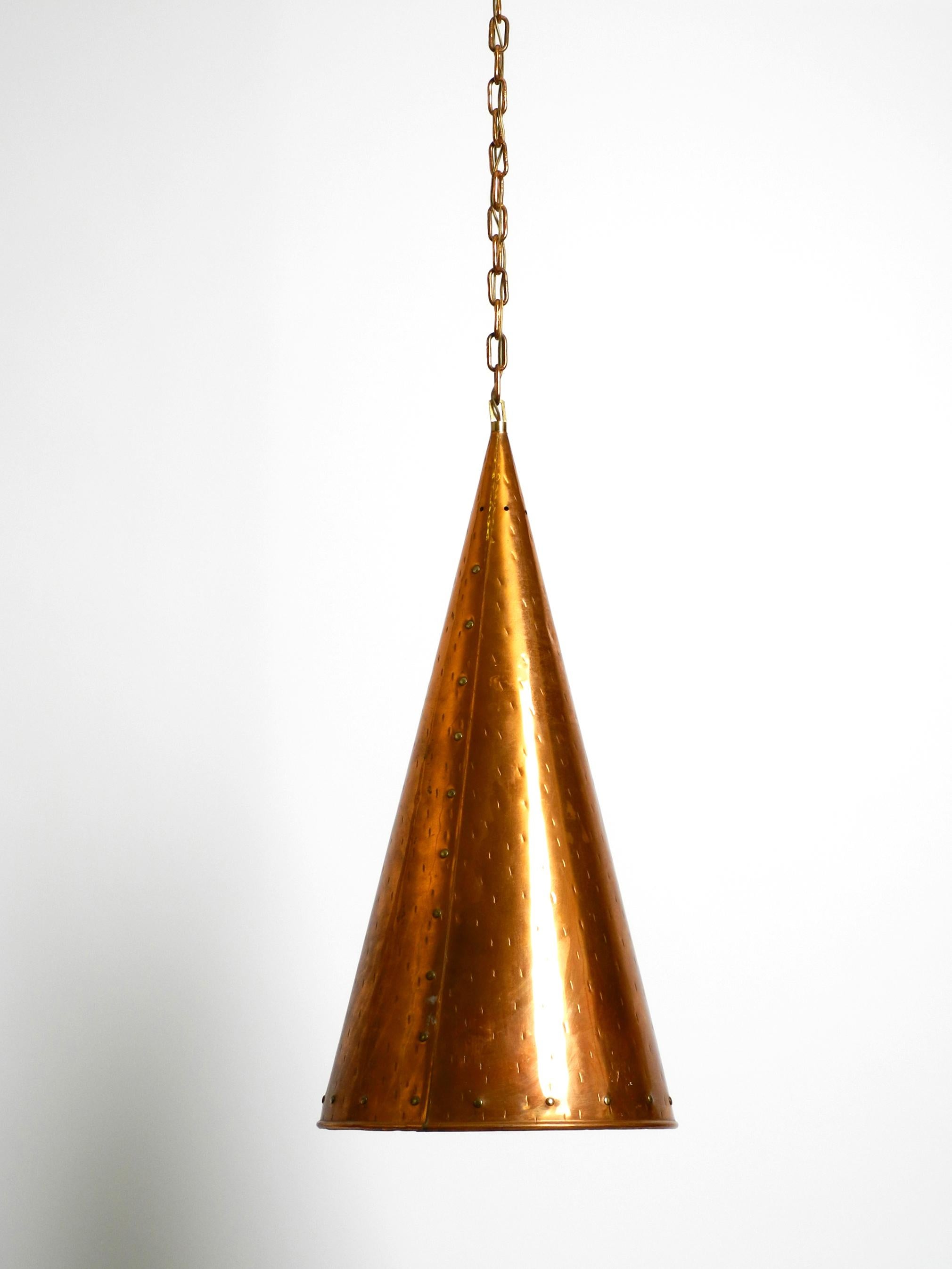 Beautiful rare huge copper pendant lamp from TH. VALENTINER Copenhagen.
Great minimalist design in the shape of a cone. Made in Denmark.
Very good vintage condition, no damages to the lamp. Just a slight dent on the shade at the top. You can see
