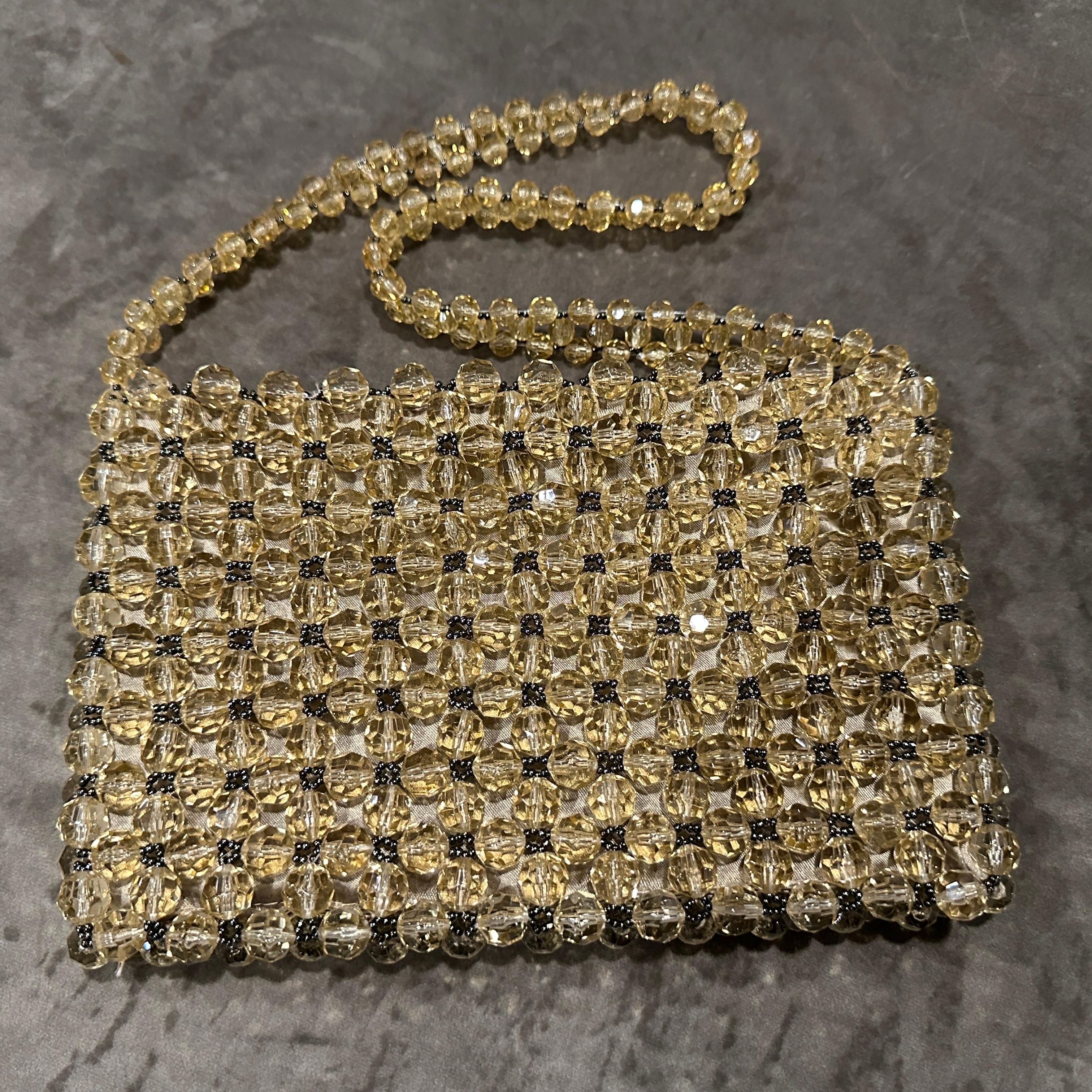A glamorous statement piece, perfect for vintage collectors or anyone channeling a retro Hollywood or Studio 54 evening look. It pairs gorgeously with a silk slip dress or a tailored suit for that timeless glam. This is a stunning 1960s Coppola e