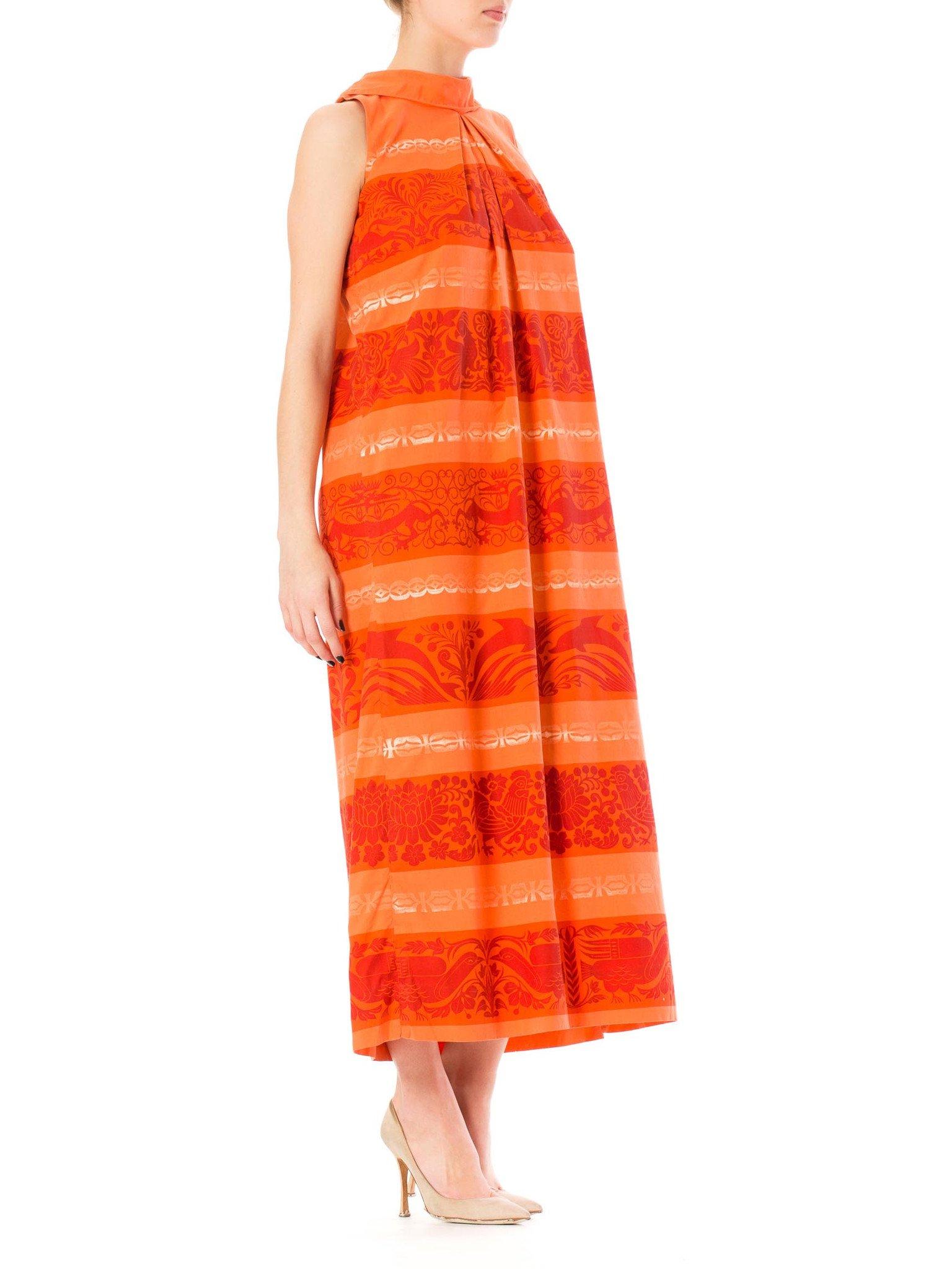 1960S Coral Cotton Tiki Print Maxi Dress With Side Slit From St. Lucia In Excellent Condition For Sale In New York, NY