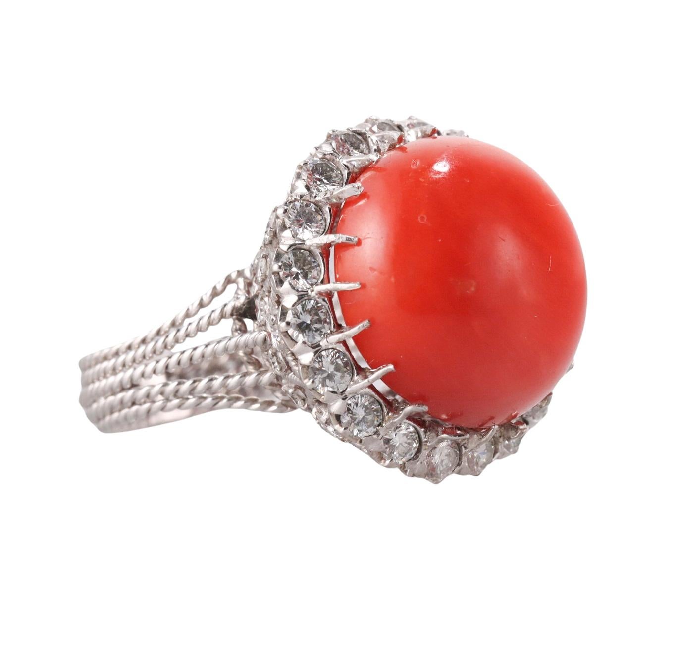 1960s vintage 18k gold cocktail ring, featuring center  17.6mm coral, surrounded with approx. 1.60ctw SI1/H diamonds.  Ring size 7.75, top is 22mm in diameter. Tested 18k, not marked. Weight of the piece - 14.5 grams. 