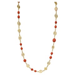 Collana a stazioni con perline vintage in oro giallo 18 carati con smalto corallo degli anni '60