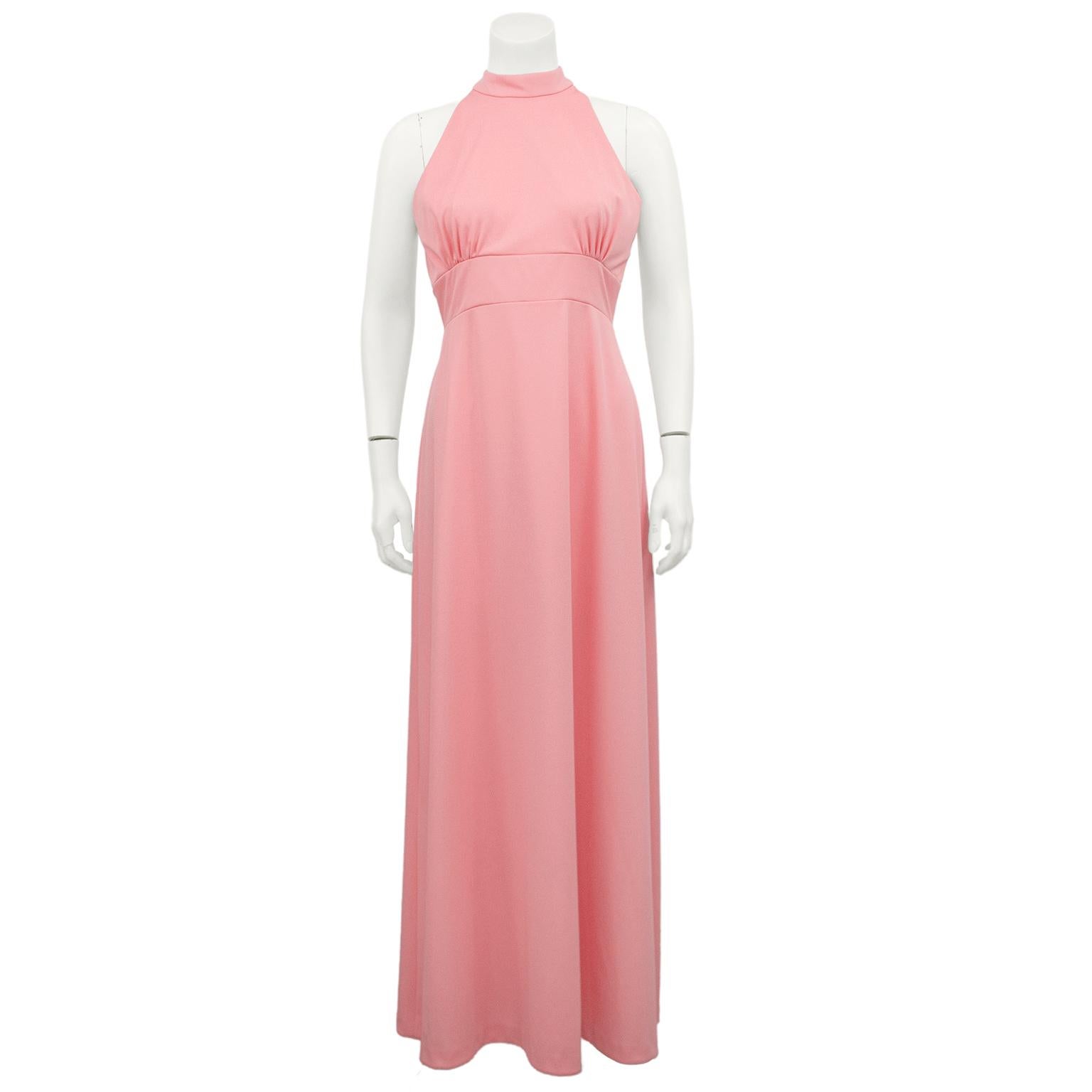 Darling coral pink  halter  top day gown and jacket ensemble from the 1960s. Poly  gown is sleeveless with high neck and ruching at bust. Empire waist with full length flowing skirt. Lace jacket is cropped with a smocked waist and bishop sleeves.