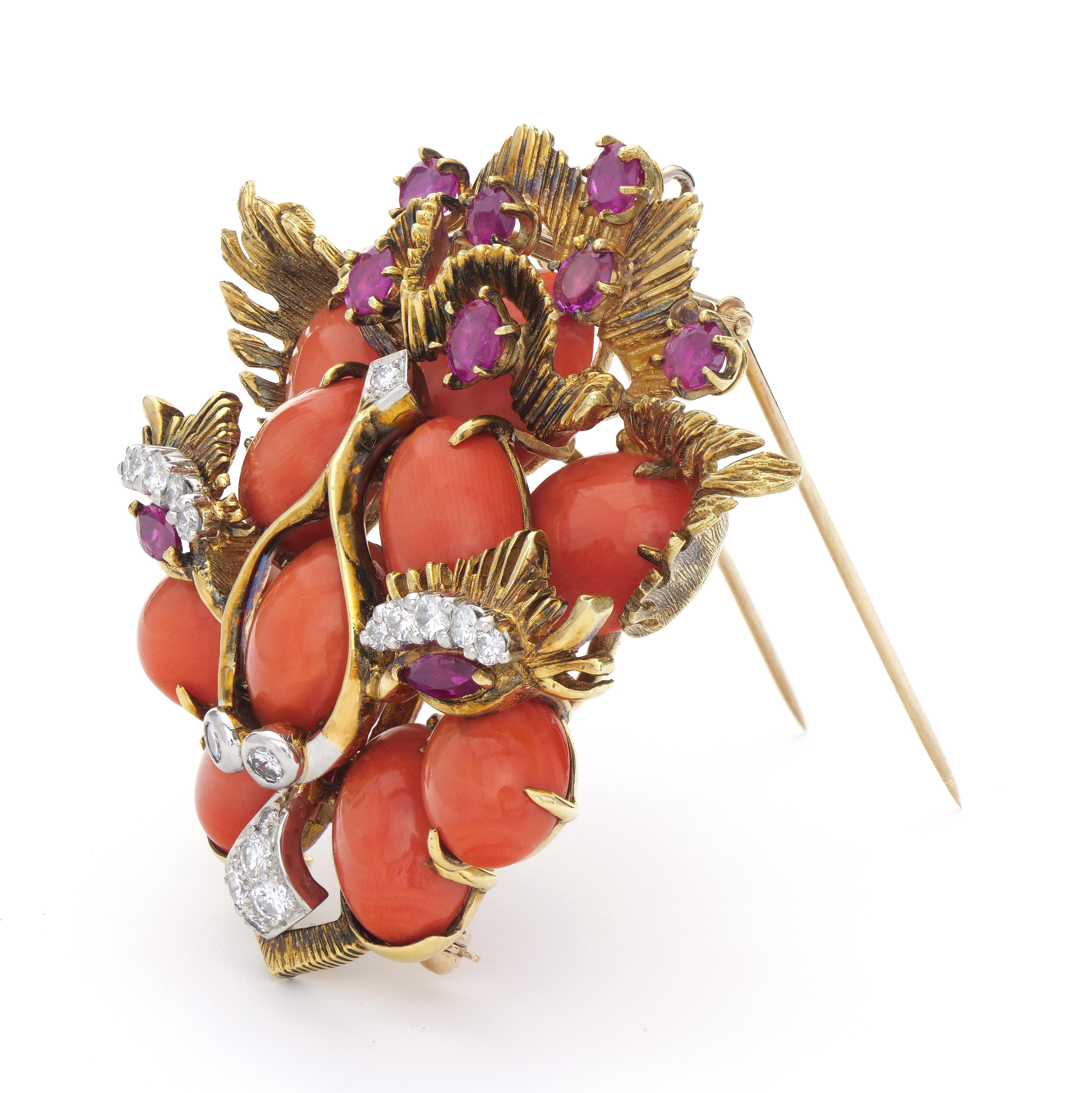 The bold cat design is a truly whimsical work of art.  Textured gold and bright orange coral are so 1960s and the rubies and diamonds give just the right amount of sparkle.  This one of a kind piece will become your go to brooch when you want a