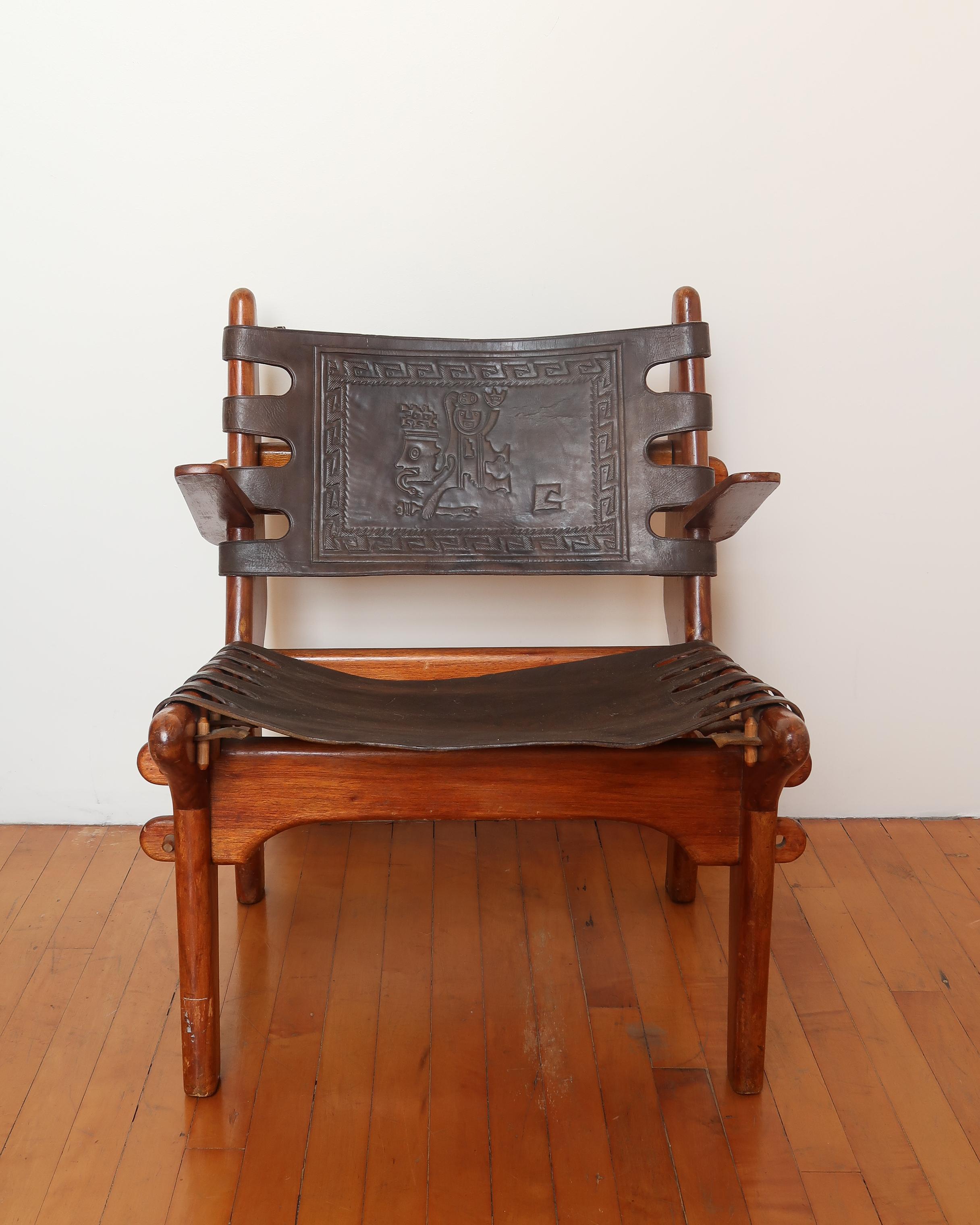 Brutalist, sculptural, and fully hand-built. This 1960s Cotacachi lounge chair by Ecuadorian designer Angel Pazmiño is crafted from solid Brazilian rosewood with thick, hand-tooled leather embossed with traditional motifs. The puzzle-like peg