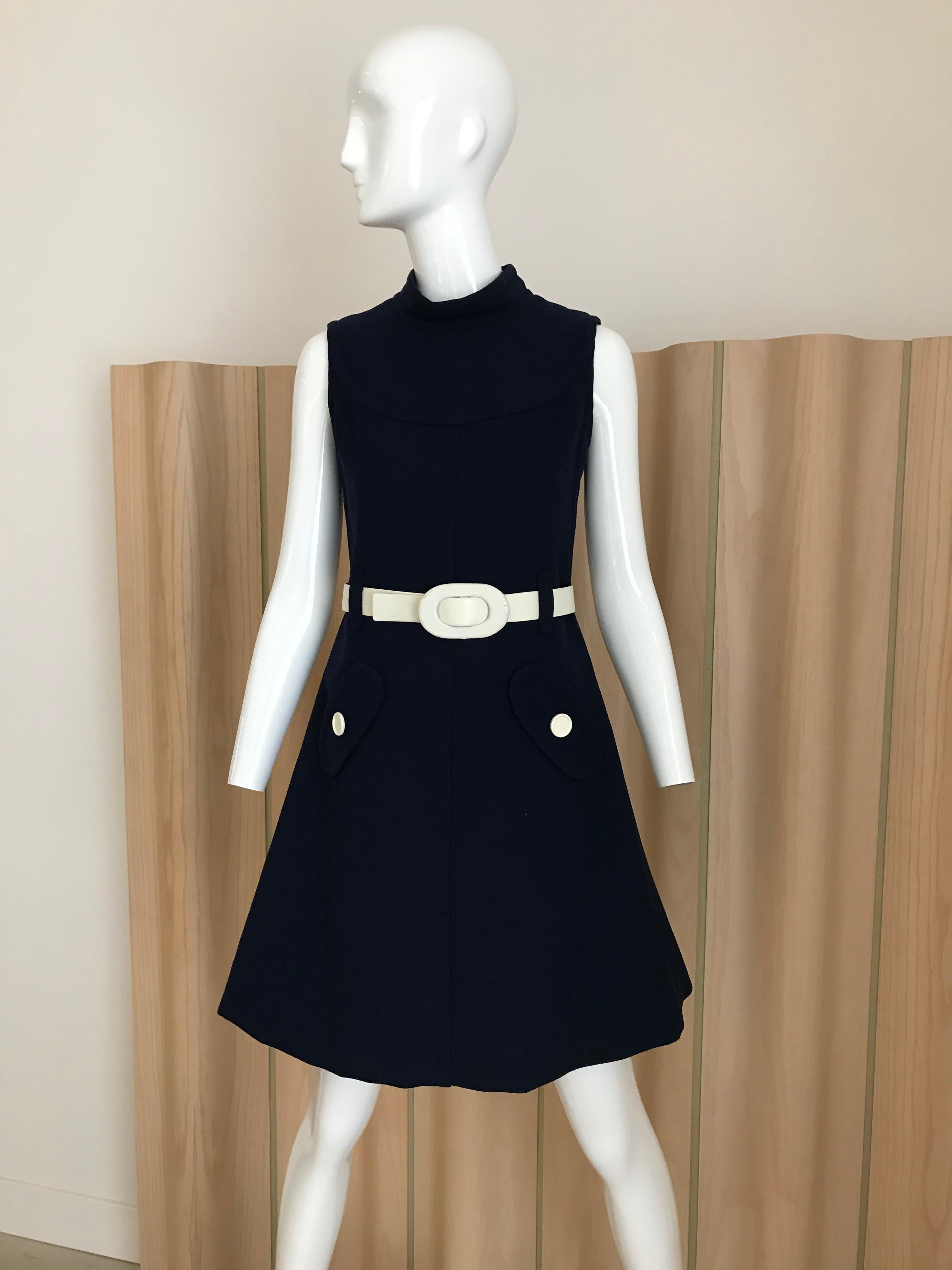Classic Vintage Courreges 1960s Navy blue shift dress with white belt and faux pockets.
Dress is fully lined. Size : Small 
Measurement: Bust : 35” / Waist : 29” / Hip: 34”/ Dress Length 34” / seam allowance on the hem 2.5 inches

Note : there is a