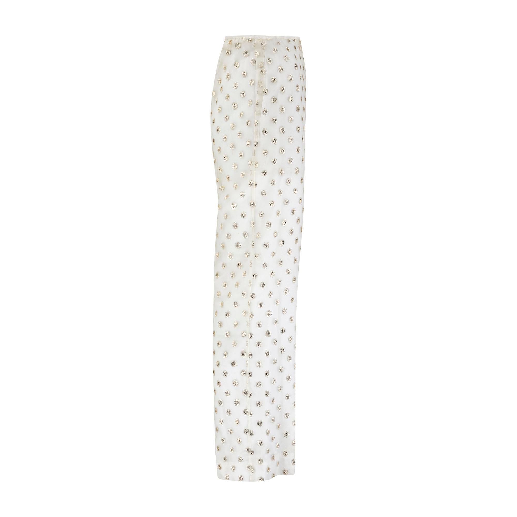 These 1960s trousers are tailored from pretty off-white manmade organza detailed with gold lamé polka-dots that glisten as they catch the light.  Tailored to a high-waist fit with a flattering bias-cut, the organza is lined in white viscose to