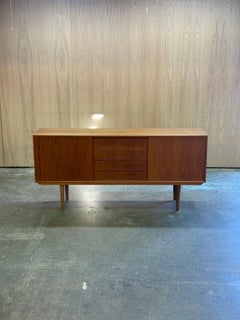 1960s Credenza by Dyrlund in teak with sliding doors and four drawers