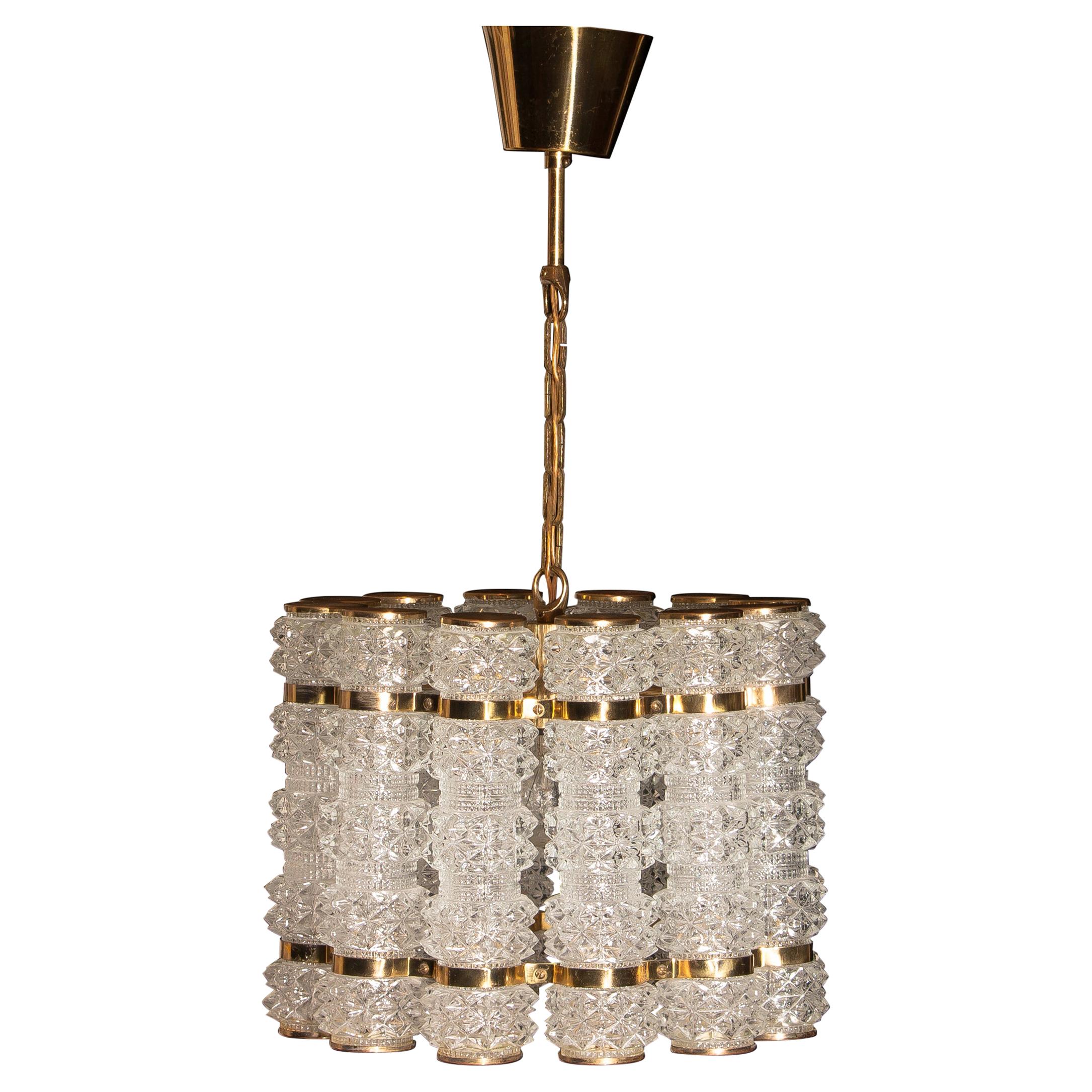 Mid-Century Modern 1960s, Crystal and Brass Cylinder Chandelier by Orrefors for Tyringe, Sweden