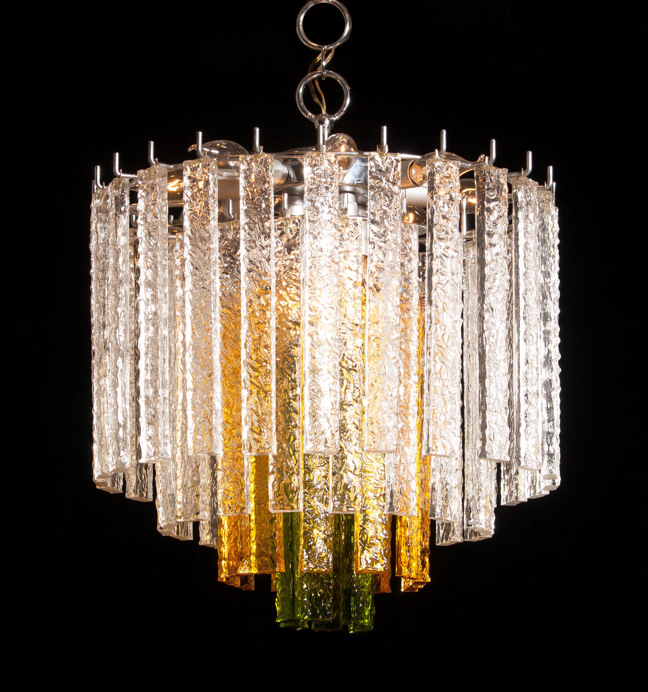 Amazing Murano Venini chandelier.
This wonderful lamp consists of a metal frame with 24 clear, 12 amber and six green Murano glass items.
It is in a beautiful and working condition.
Period 1960s
Dimensions: H 55 cm, ø 50 cm.