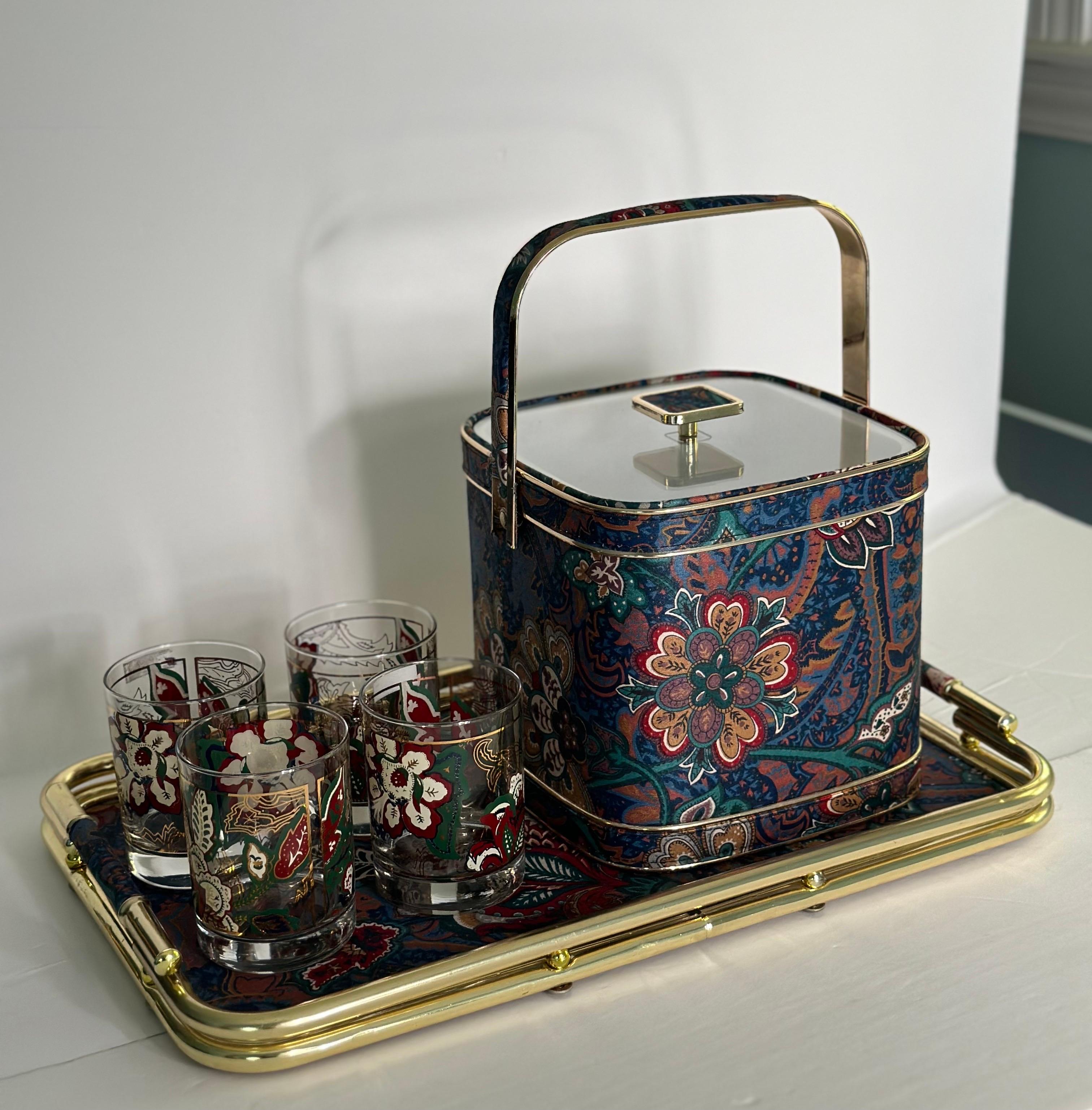 We are very pleased to offer an exquisite barware set, by Culver, circa the 1960s.  This set epitomizes the quintessential Mid-century modern design era with a captivating pattern, enriched by the presence of intricate gold details.  The Ice Bucket
