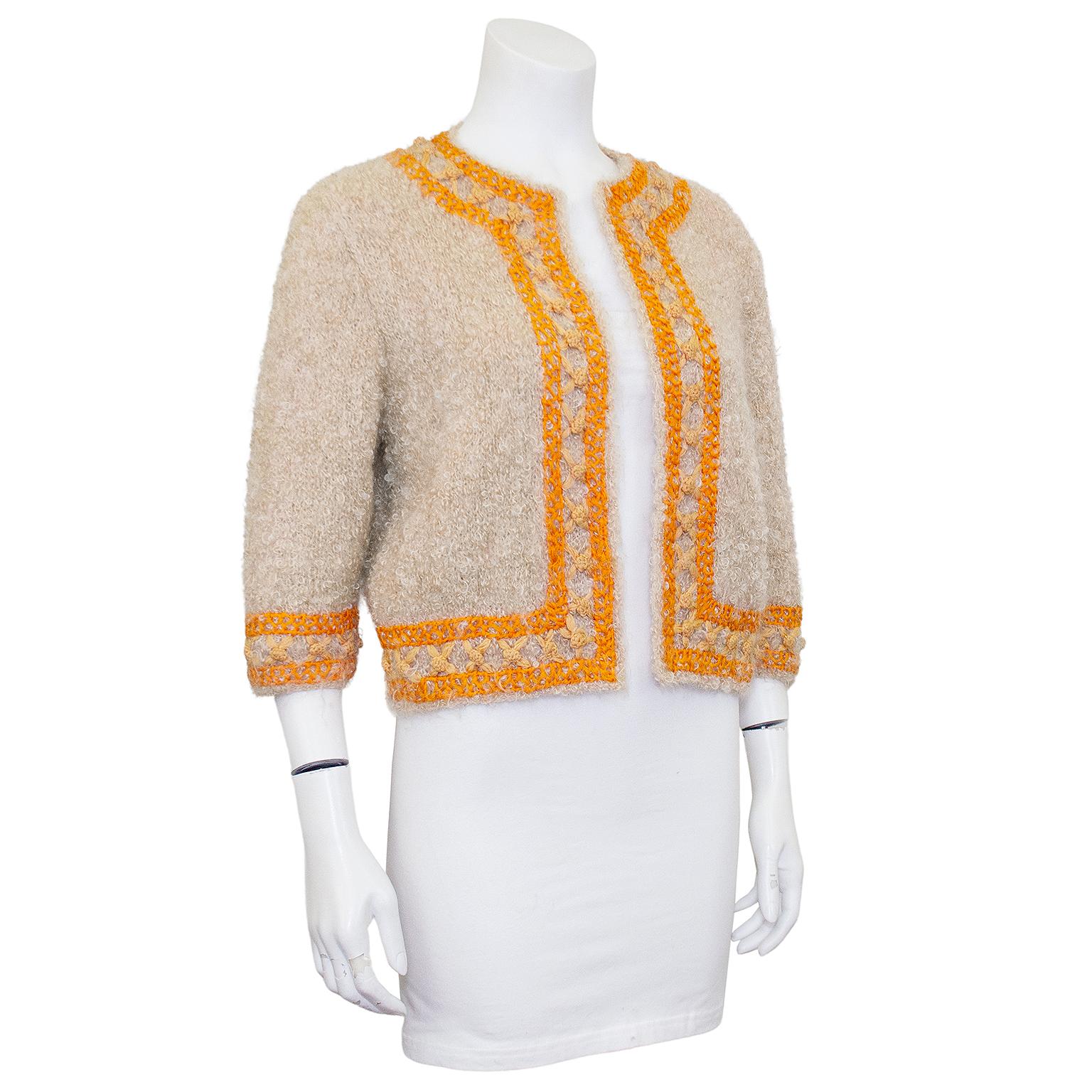 The perfect added touch for your summer cottons. 1960's custom knit light tan mohair 3/4 sleeve bolero with orange hand embroidered trim. This was an extremely skilled knitter who showcased her talents on this unique piece. In excellent condition,