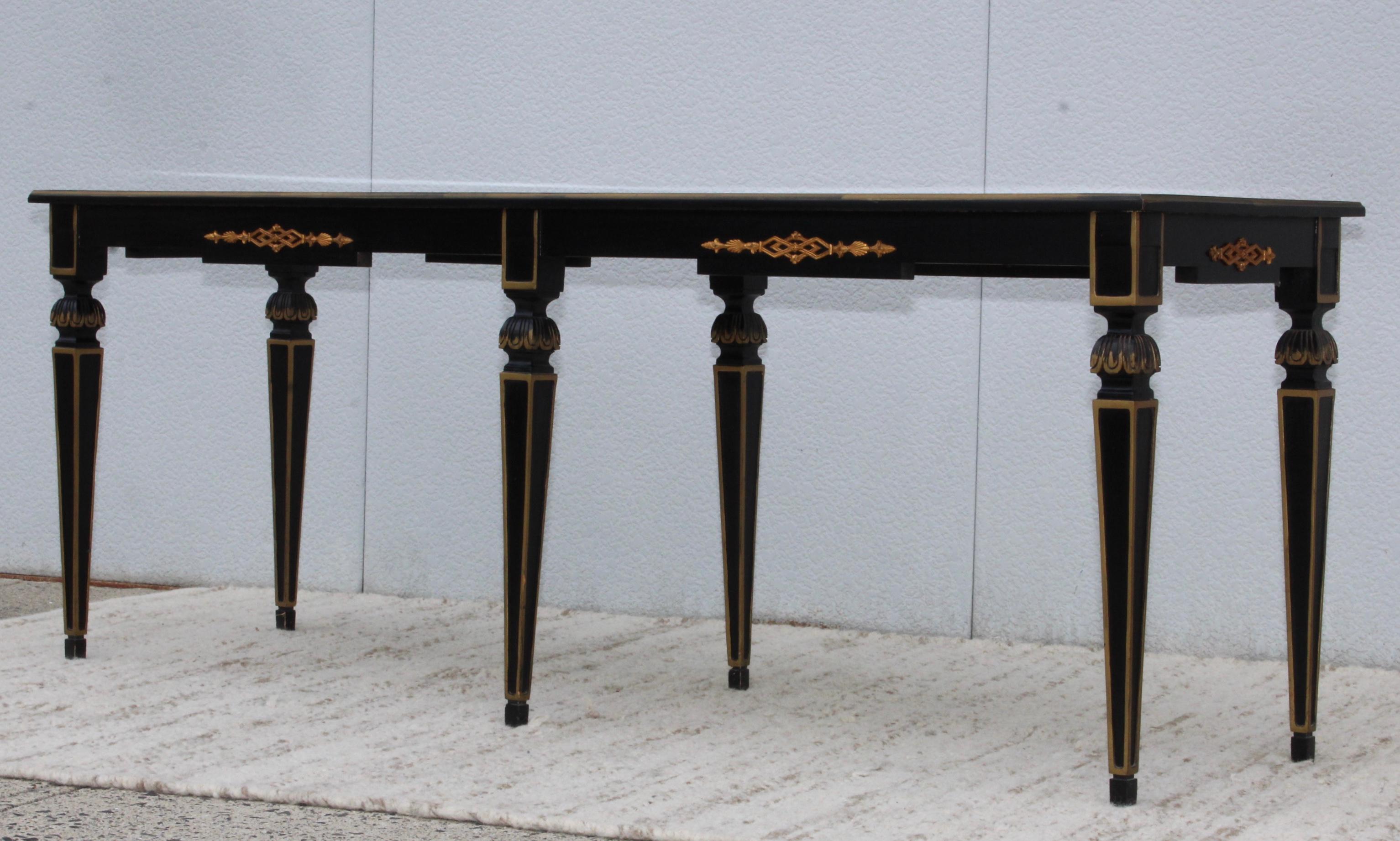 1960s custom made long wood console with gilt and brass detail, the top is reverse glass gold leaf finish.