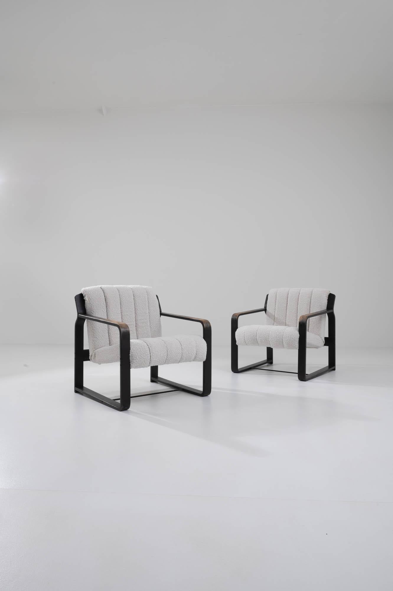 Effortlessly combining style and comfort, this pair of Mid Century Modern armchairs are a covetable find. Produced in the 1960s in the former Czechoslovakia, the design is attributed to Ludvik Volak, an architect and furniture designer known for his
