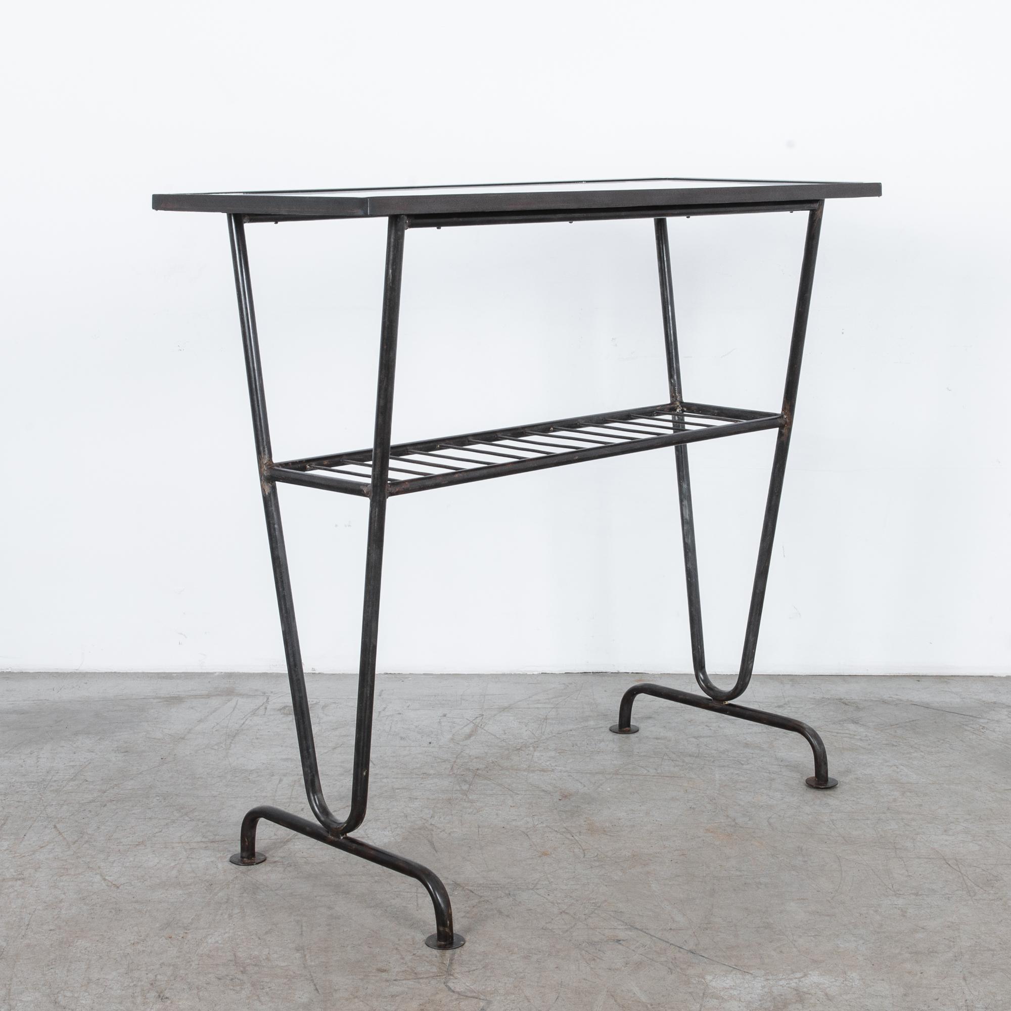 In the innovative design landscape of 1960s Czechoslovakia, this metal side table epitomizes the sleek sophistication and functional elegance of the era. Crafted with meticulous attention to detail, this piece represents the epitome of Czech